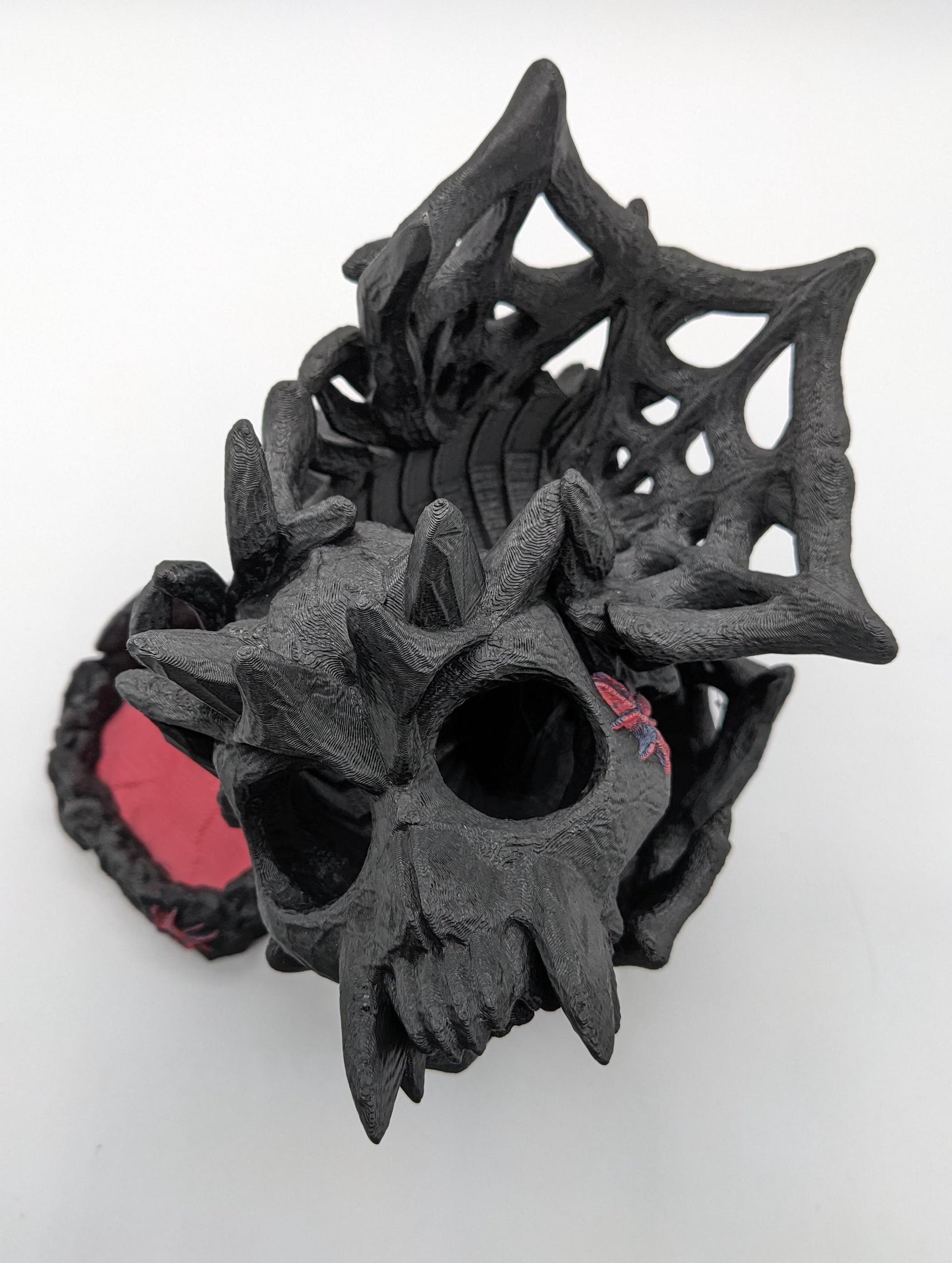 Handcrafted with eerie detail, this 3D printed dice tower combines functionality with a touch of the macabre, making it the perfect addition to any tabletop game. Whether you're a seasoned gamer or a newcomer, this spooky accessory is designed to enhance your gameplay with a chilling twist.