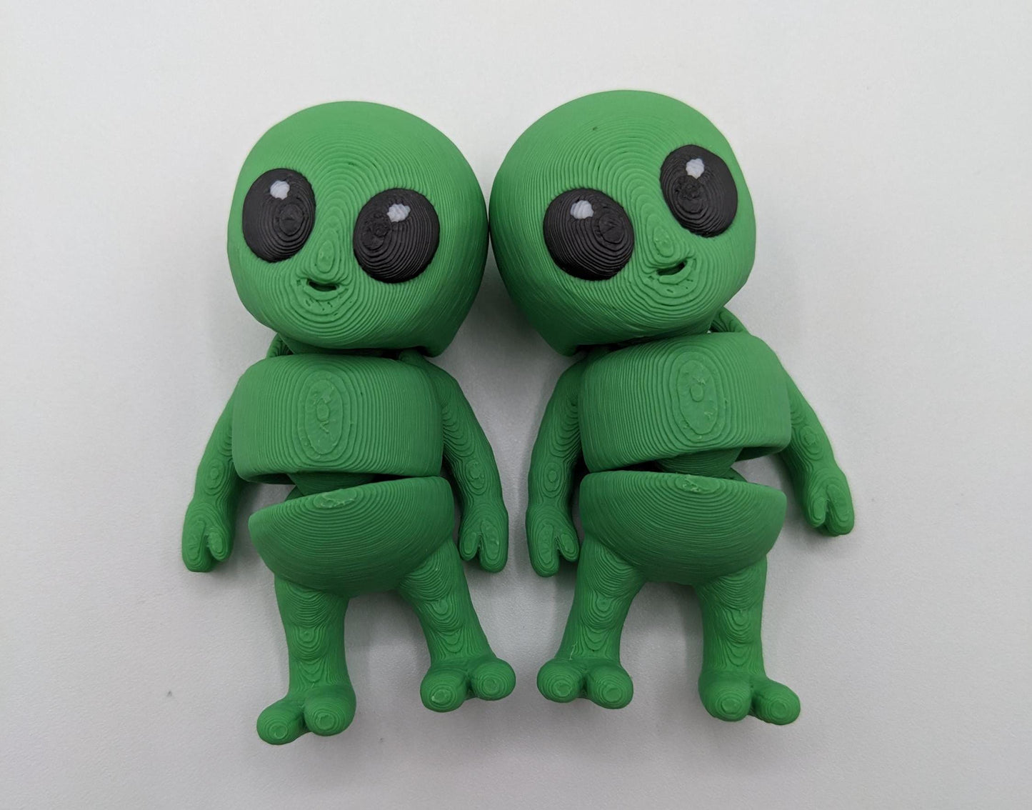 Say hello to the Tiny Alien Fidget Toy, a fun and quirky companion thatâs out of this world! This 3D-printed alien is designed for fidgeting, stress relief, and endless entertainment. Its compact size makes it perfect to carry in your pocket, and its unique design is sure to spark smiles wherever you go. Whether youâre looking for a fun desk toy, a creative gift, or a unique collectible, this tiny alien is a must-have!