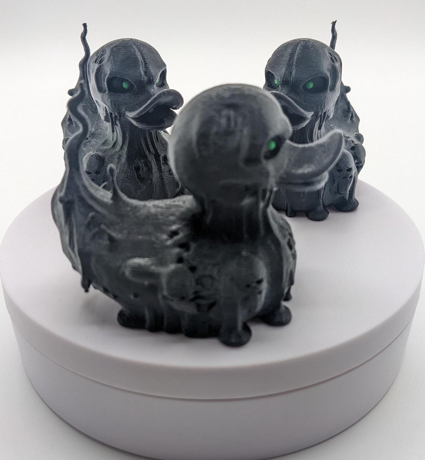 Meet our Scary Evil Spirit Duck, a spooky, quirky 3D-printed, (not painted), creation combining a classic duck with a haunting twist. It's creepy design & eerie features, this duck is perfect for Halloween decor, horror enthusiasts, Jeep duck collectors, or anyone who loves  spooky collectibles. Whether displayed on the dash of your Jeep, perched on your shelf, added to your haunted decorations, or gifted to a lover of the macabre, this evil spirit duck is guaranteed to make a scary statement!