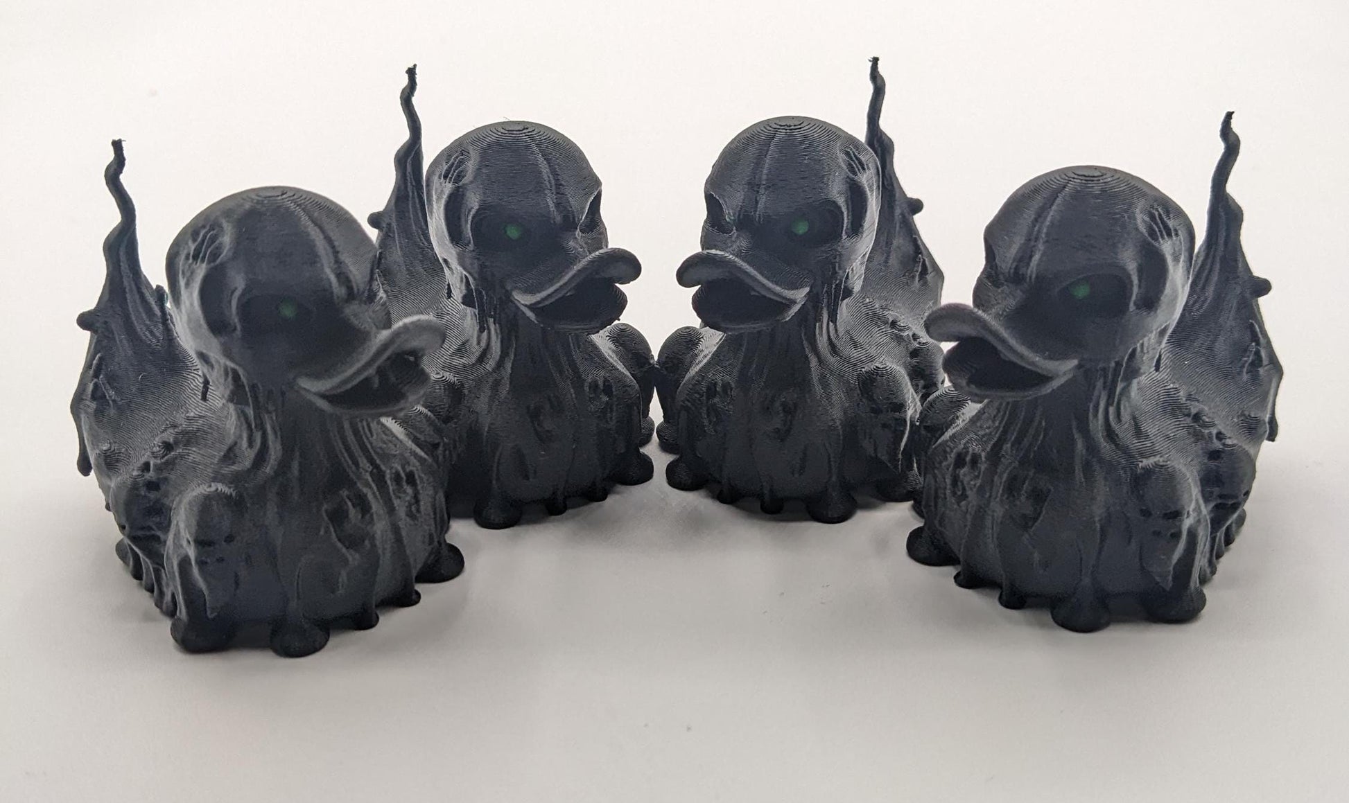 Meet our Scary Evil Spirit Duck, a spooky, quirky 3D-printed, (not painted), creation combining a classic duck with a haunting twist. It's creepy design & eerie features, this duck is perfect for Halloween decor, horror enthusiasts, Jeep duck collectors, or anyone who loves  spooky collectibles. Whether displayed on the dash of your Jeep, perched on your shelf, added to your haunted decorations, or gifted to a lover of the macabre, this evil spirit duck is guaranteed to make a scary statement!