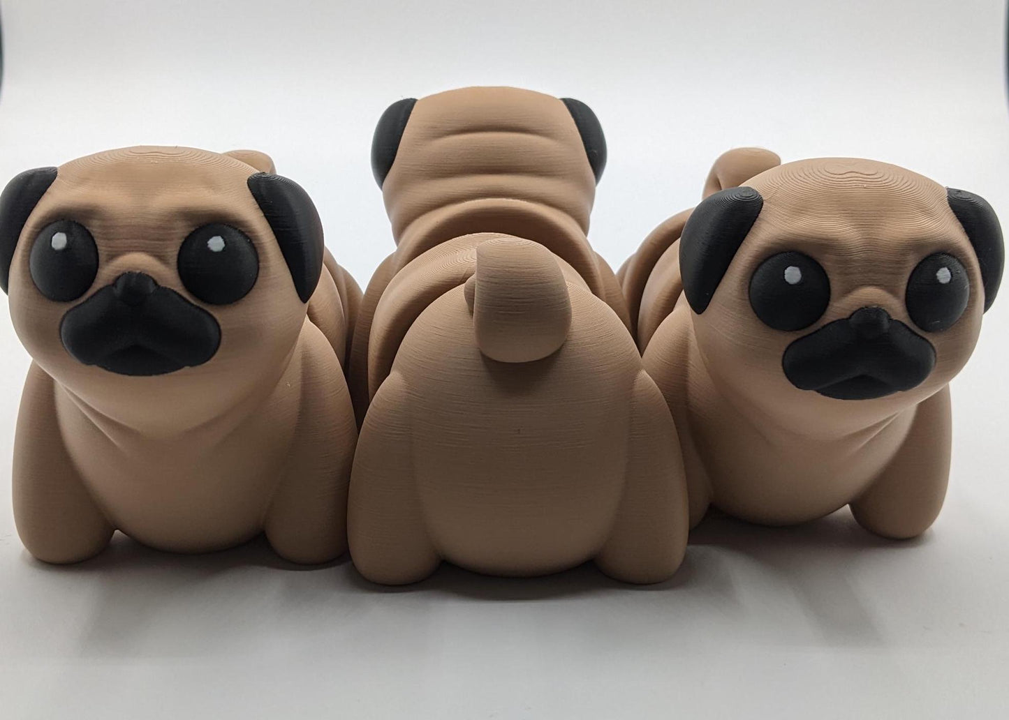 Man's best friend & the clown of the dog breeds, our adorable pug with it's larger size makes it even more fun to handle, while capturing the mischievous charm of your puggy friend. Whether you’re looking for a unique gift, a relaxing fidget toy, or a playful decoration, this pug puppy will bring endless joy & stress relief.