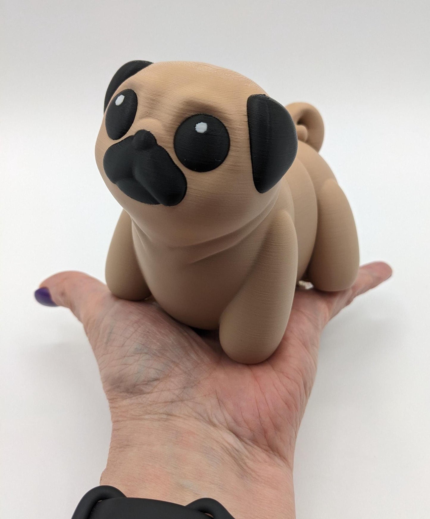 Man's best friend & the clown of the dog breeds, our adorable pug with it's larger size makes it even more fun to handle, while capturing the mischievous charm of your puggy friend. Whether you’re looking for a unique gift, a relaxing fidget toy, or a playful decoration, this pug puppy will bring endless joy & stress relief.
