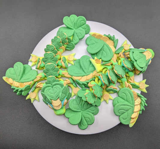 Meet our Adorable Tiny Baby Clover Dragon featuring intricate details & whimsical design, inspired by the luck & charm of clovers. Perfect for dragon enthusiasts or anyone who loves all things small. With the luck of the leprechaun, this little dragon is the perfect lucky charm. Small enough to carry in your pocket or display on desks, shelves, or computer.