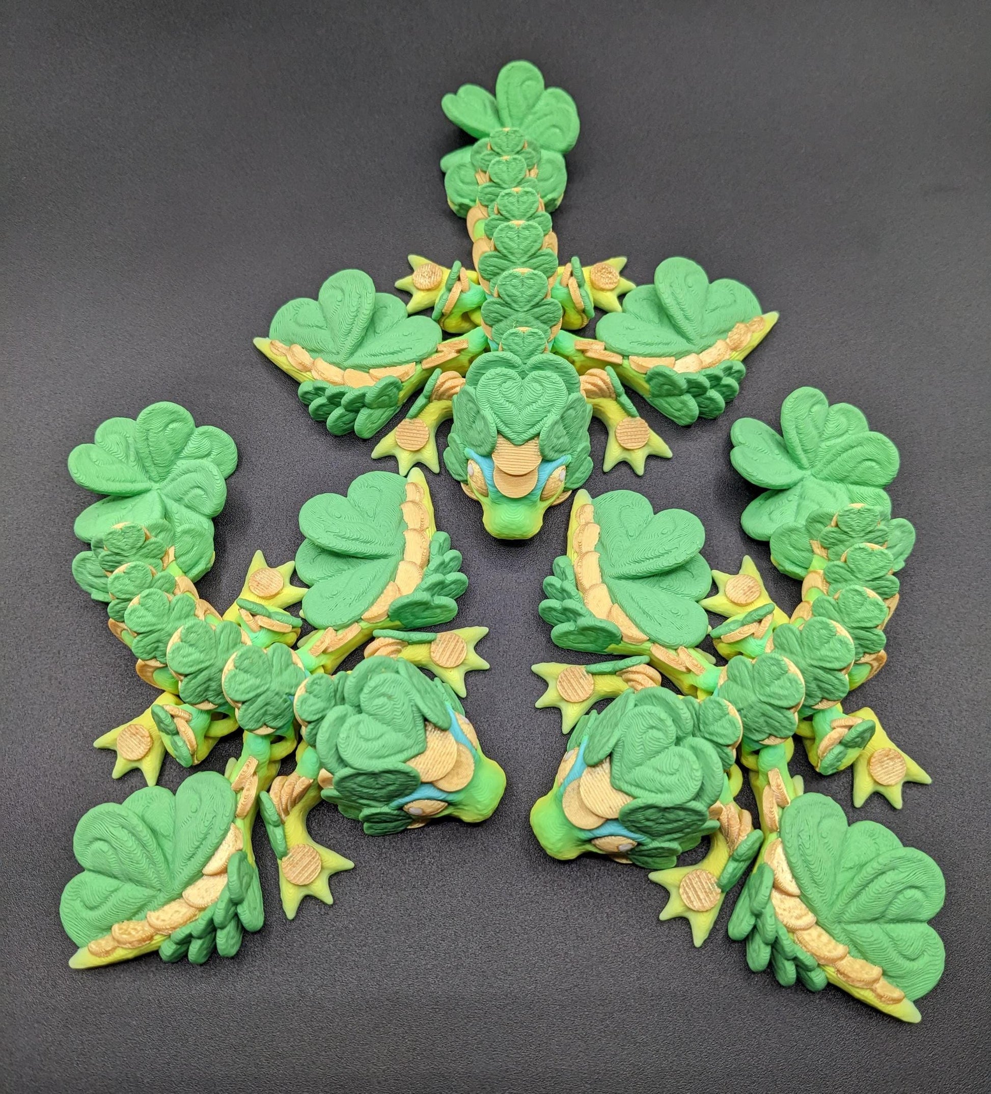 Meet our Adorable Tiny Baby Clover Dragon featuring intricate details & whimsical design, inspired by the luck & charm of clovers. Perfect for dragon enthusiasts or anyone who loves all things small. With the luck of the leprechaun, this little dragon is the perfect lucky charm. Small enough to carry in your pocket or display on desks, shelves, or computer.