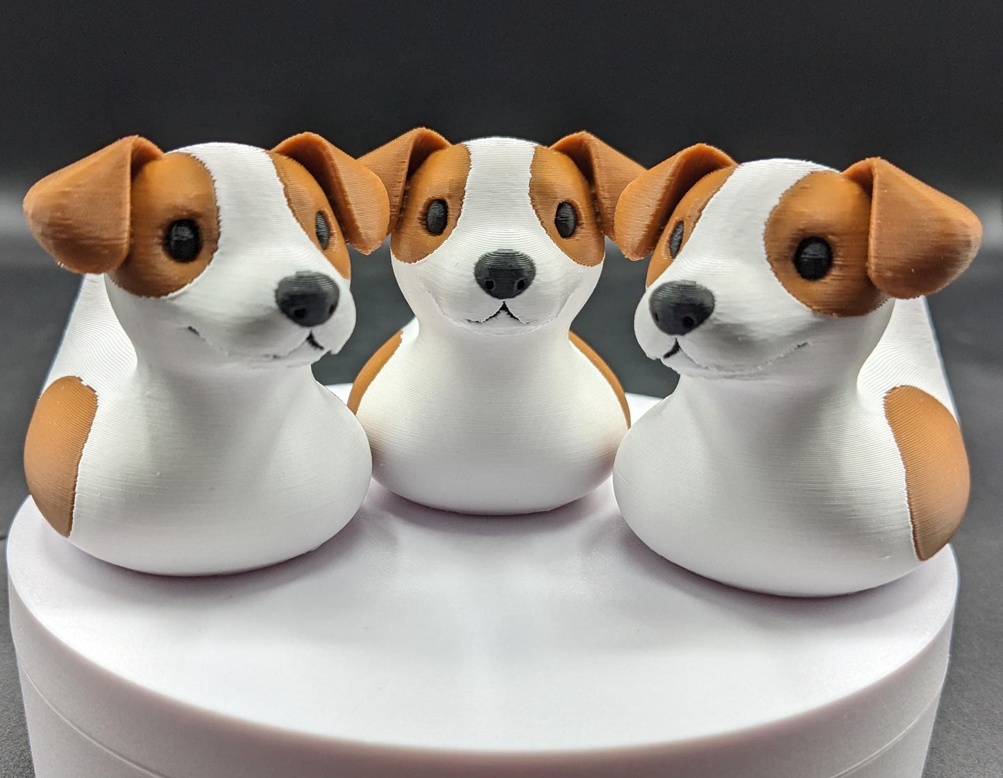 All our ducks are printed in PETG filament, a more expensive filament without the upcharge, as PETG is UV stable, heat and moisture tolerant. PLA color will fade if left on the dash of a car or in direct sunlight. Say hello to the Friendly Jack Russell Terrier Dog Duck Toy, the perfect blend of playful charm and quirky creativity! Whether you’re a dog lover, a Jeep duck collector, or simply someone who enjoys unique and fun decor, this adorable hybrid toy is sure to bring a smile to your face.