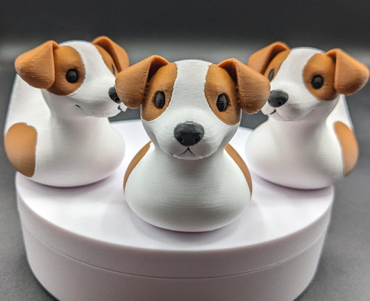 All our ducks are printed in PETG filament, a more expensive filament without the upcharge, as PETG is UV stable, heat and moisture tolerant. PLA color will fade if left on the dash of a car or in direct sunlight. Say hello to the Friendly Jack Russell Terrier Dog Duck Toy, the perfect blend of playful charm and quirky creativity! Whether you’re a dog lover, a Jeep duck collector, or simply someone who enjoys unique and fun decor, this adorable hybrid toy is sure to bring a smile to your face.