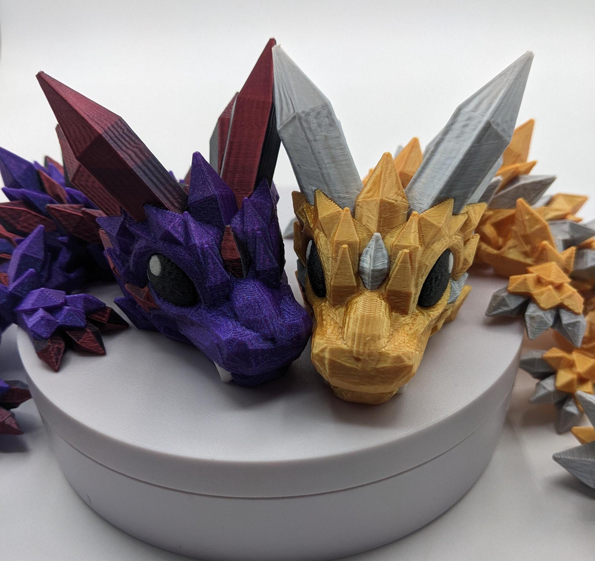 Bring a touch of magic to your life with the Adorable Articulated Baby Crystal Dragon! This 3D-printed masterpiece is designed with intricate details and fully articulated joints, making it a playful and poseable collectible that’s perfect for dragon lovers, fantasy fans, and unique gift seekers. Inspired by the elegance of crystals and the charm of baby dragons, this figurine is both whimsical and eye-catching.