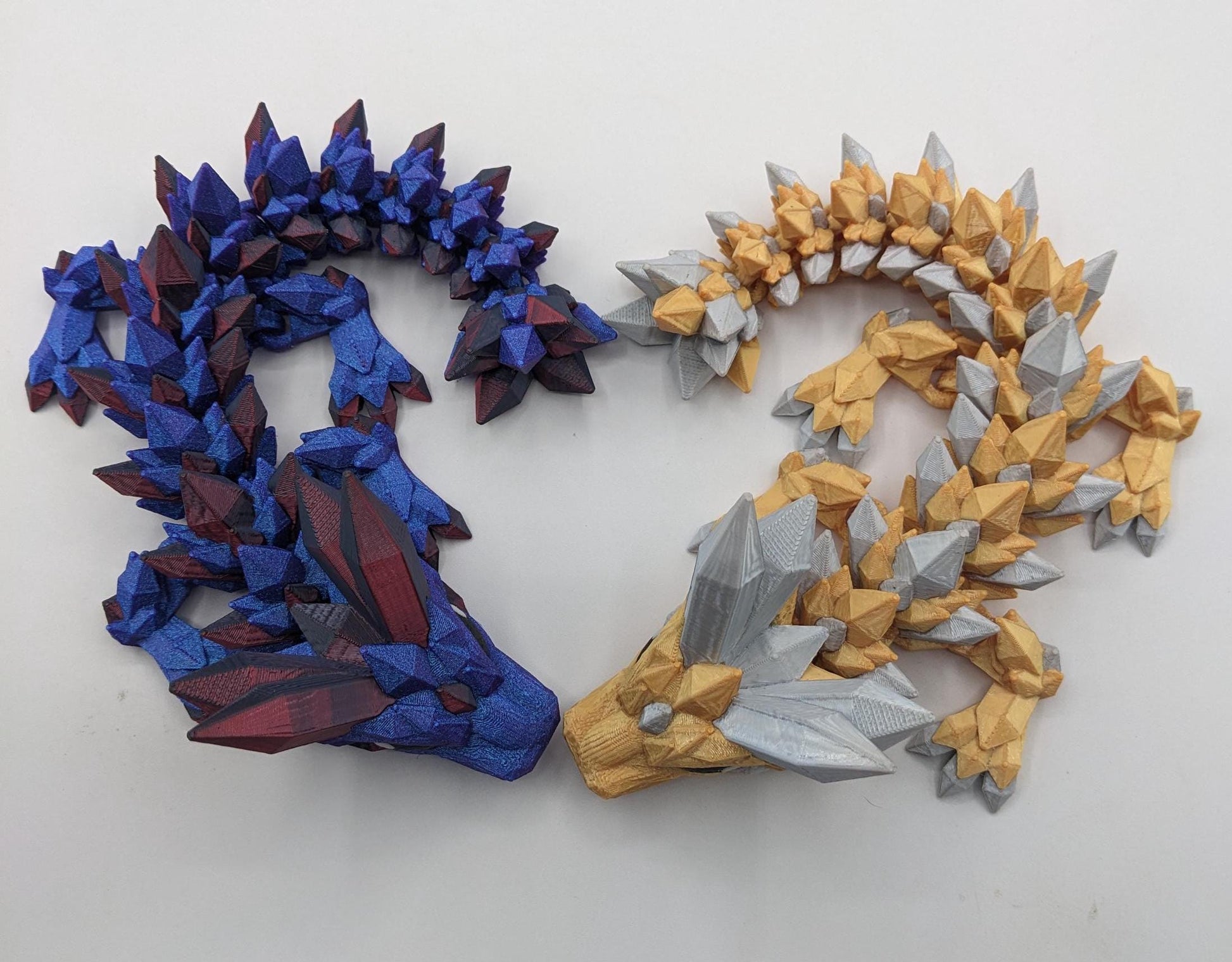 Bring a touch of magic to your life with the Adorable Articulated Baby Crystal Dragon! This 3D-printed masterpiece is designed with intricate details and fully articulated joints, making it a playful and poseable collectible that’s perfect for dragon lovers, fantasy fans, and unique gift seekers. Inspired by the elegance of crystals and the charm of baby dragons, this figurine is both whimsical and eye-catching.
