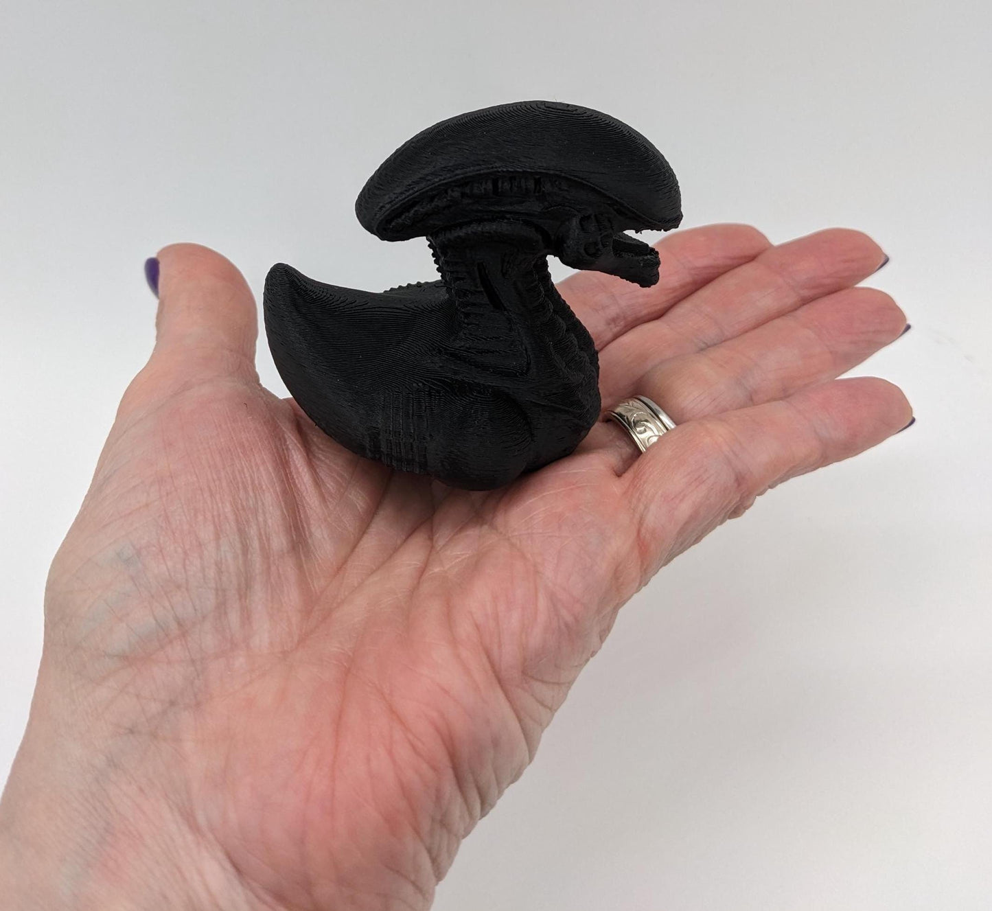 Step into the world of sci-fi and whimsy with the Alien Xenomorph Duck! This one-of-a-kind 3D-printed creation combines the eerie, iconic design of an alien xenomorph with the playful charm of a duck. Perfect for fans of alien creatures, sci-fi enthusiasts, Jeep duck collectors, or anyone who loves quirky collectibles, this hybrid figurine is sure to stand out in any collection.