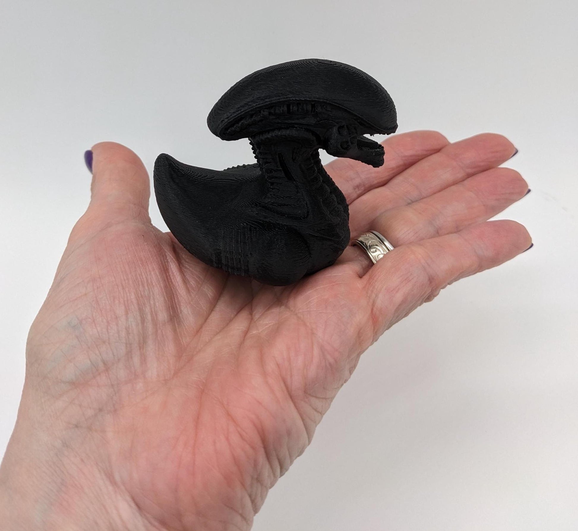 Step into the world of sci-fi and whimsy with the Alien Xenomorph Duck! This one-of-a-kind 3D-printed creation combines the eerie, iconic design of an alien xenomorph with the playful charm of a duck. Perfect for fans of alien creatures, sci-fi enthusiasts, Jeep duck collectors, or anyone who loves quirky collectibles, this hybrid figurine is sure to stand out in any collection.