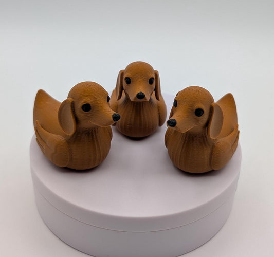Say hello to the Adorable Dachshund Wiener Dog Duck, a quirky and lovable 3D-printed hybrid that combines the long-bodied charm of a dachshund with the playful personality of a duck. This whimsical design is perfect for dog lovers, dachshund enthusiasts, Jeep duck collectors, or anyone who enjoys unique and creative collectibles.