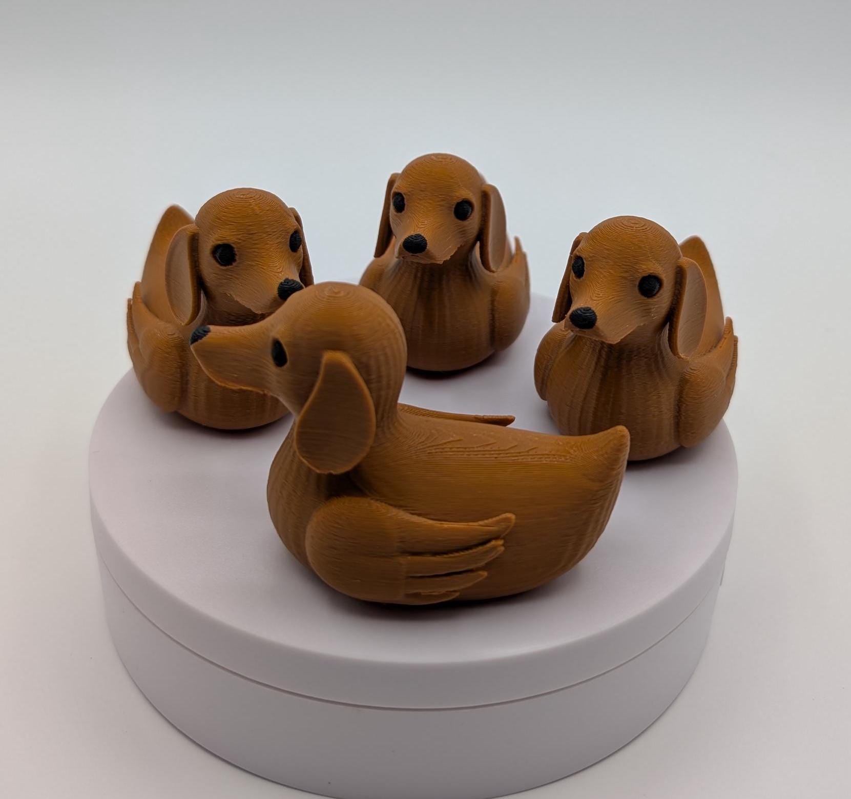 Say hello to the Adorable Dachshund Wiener Dog Duck, a quirky and lovable 3D-printed hybrid that combines the long-bodied charm of a dachshund with the playful personality of a duck. This whimsical design is perfect for dog lovers, dachshund enthusiasts, Jeep duck collectors, or anyone who enjoys unique and creative collectibles.