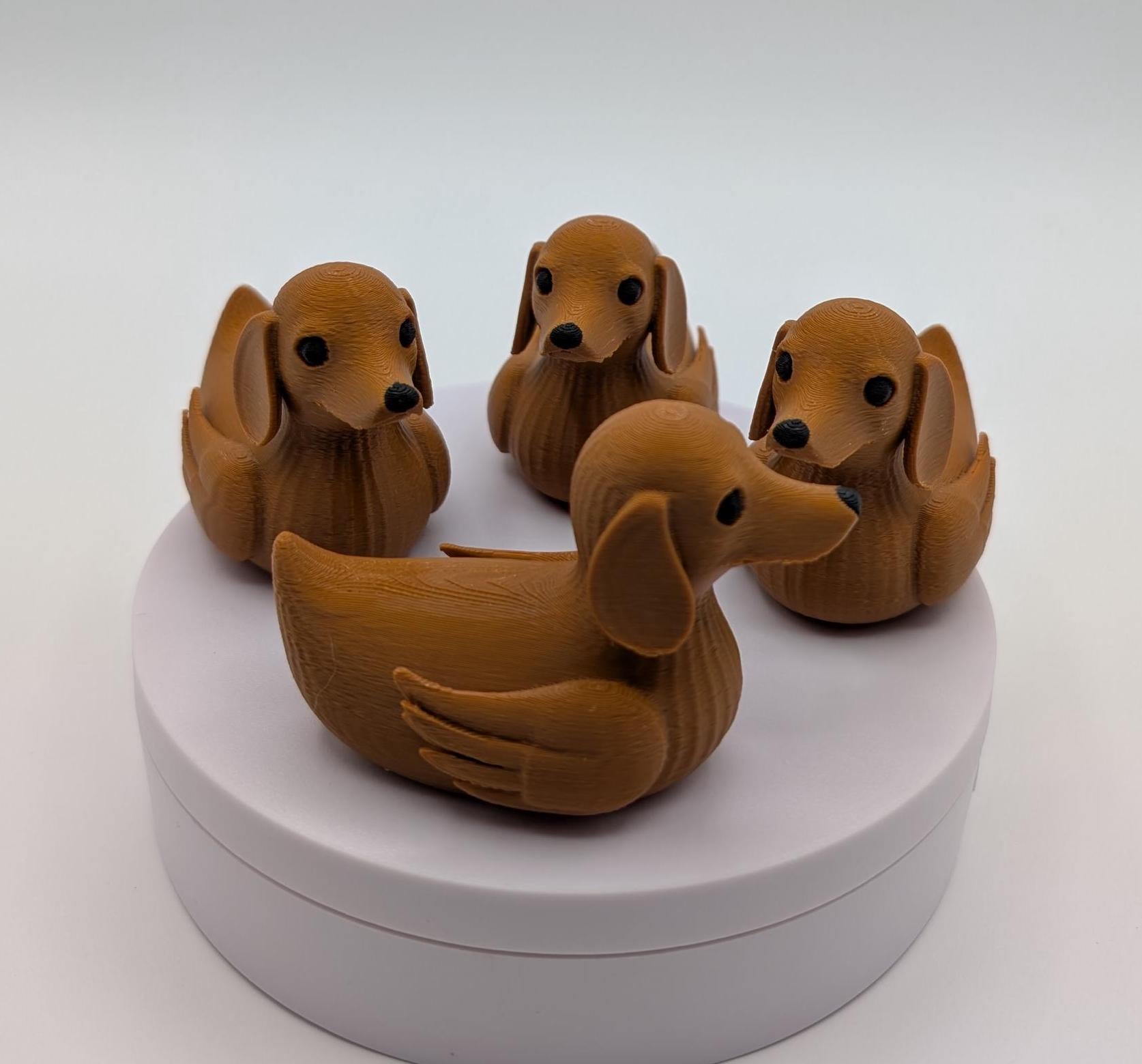 Say hello to the Adorable Dachshund Wiener Dog Duck, a quirky and lovable 3D-printed hybrid that combines the long-bodied charm of a dachshund with the playful personality of a duck. This whimsical design is perfect for dog lovers, dachshund enthusiasts, Jeep duck collectors, or anyone who enjoys unique and creative collectibles.