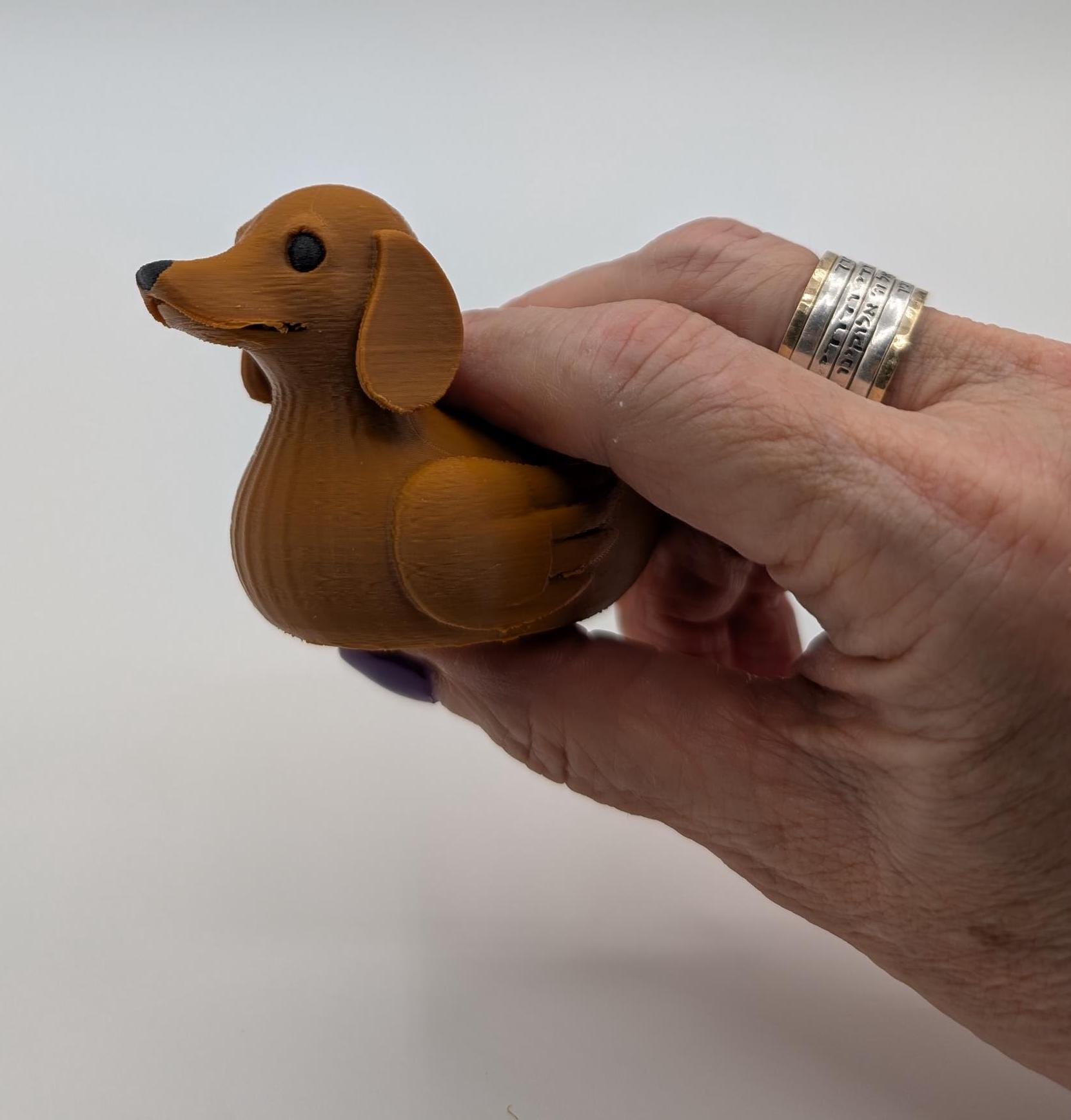 Say hello to the Adorable Dachshund Wiener Dog Duck, a quirky and lovable 3D-printed hybrid that combines the long-bodied charm of a dachshund with the playful personality of a duck. This whimsical design is perfect for dog lovers, dachshund enthusiasts, Jeep duck collectors, or anyone who enjoys unique and creative collectibles.