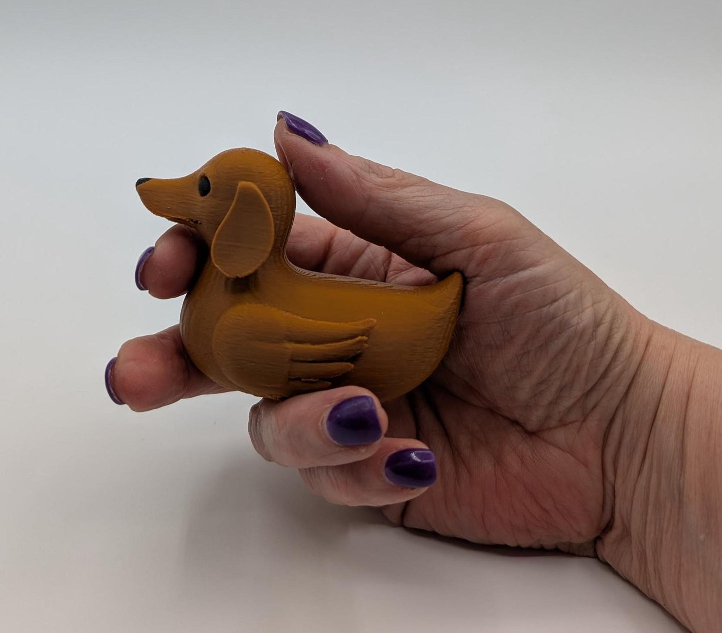 Say hello to the Adorable Dachshund Wiener Dog Duck, a quirky and lovable 3D-printed hybrid that combines the long-bodied charm of a dachshund with the playful personality of a duck. This whimsical design is perfect for dog lovers, dachshund enthusiasts, Jeep duck collectors, or anyone who enjoys unique and creative collectibles.