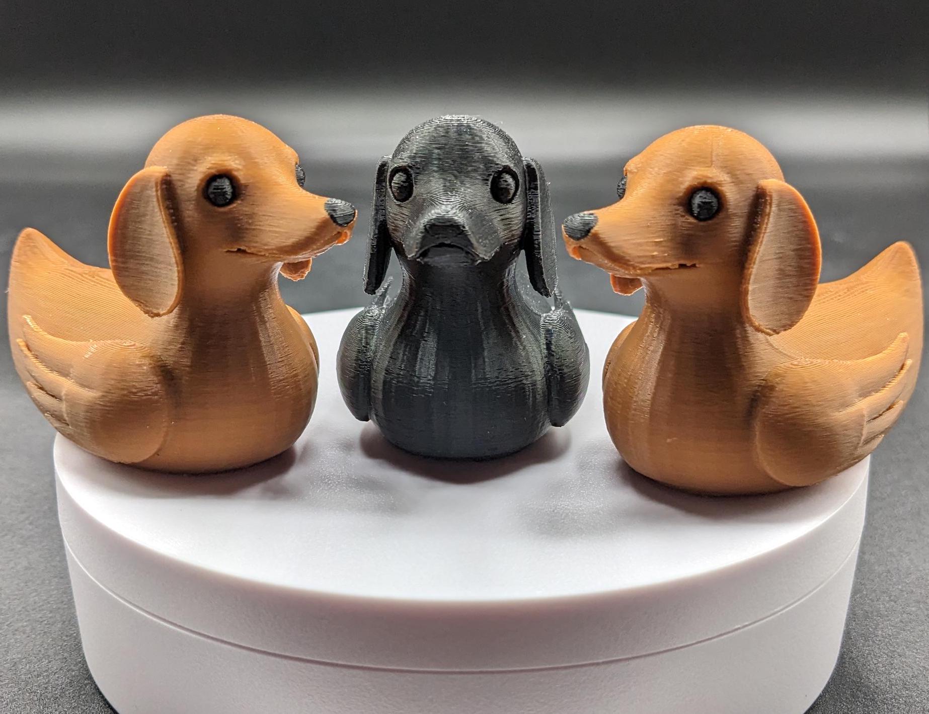 Say hello to the Adorable Dachshund Wiener Dog Duck, a quirky and lovable 3D-printed hybrid that combines the long-bodied charm of a dachshund with the playful personality of a duck. This whimsical design is perfect for dog lovers, dachshund enthusiasts, Jeep duck collectors, or anyone who enjoys unique and creative collectibles.