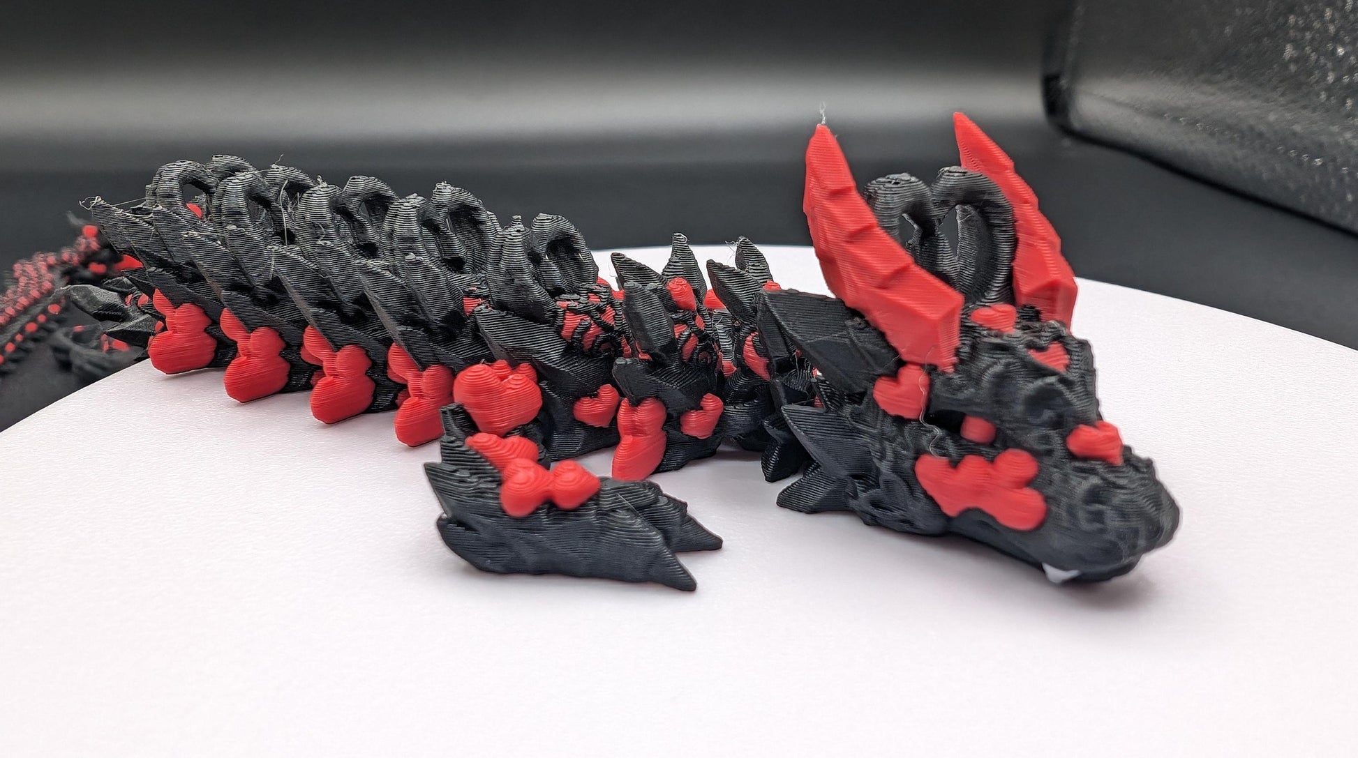 Discover the magic of our Valentine Heart Dragon! This enchanting articulating dragon not only graces your bookshelf with whimsy but also makes for a heartfelt and unforgettable Valentine's Day gift. Elevate your space with love!