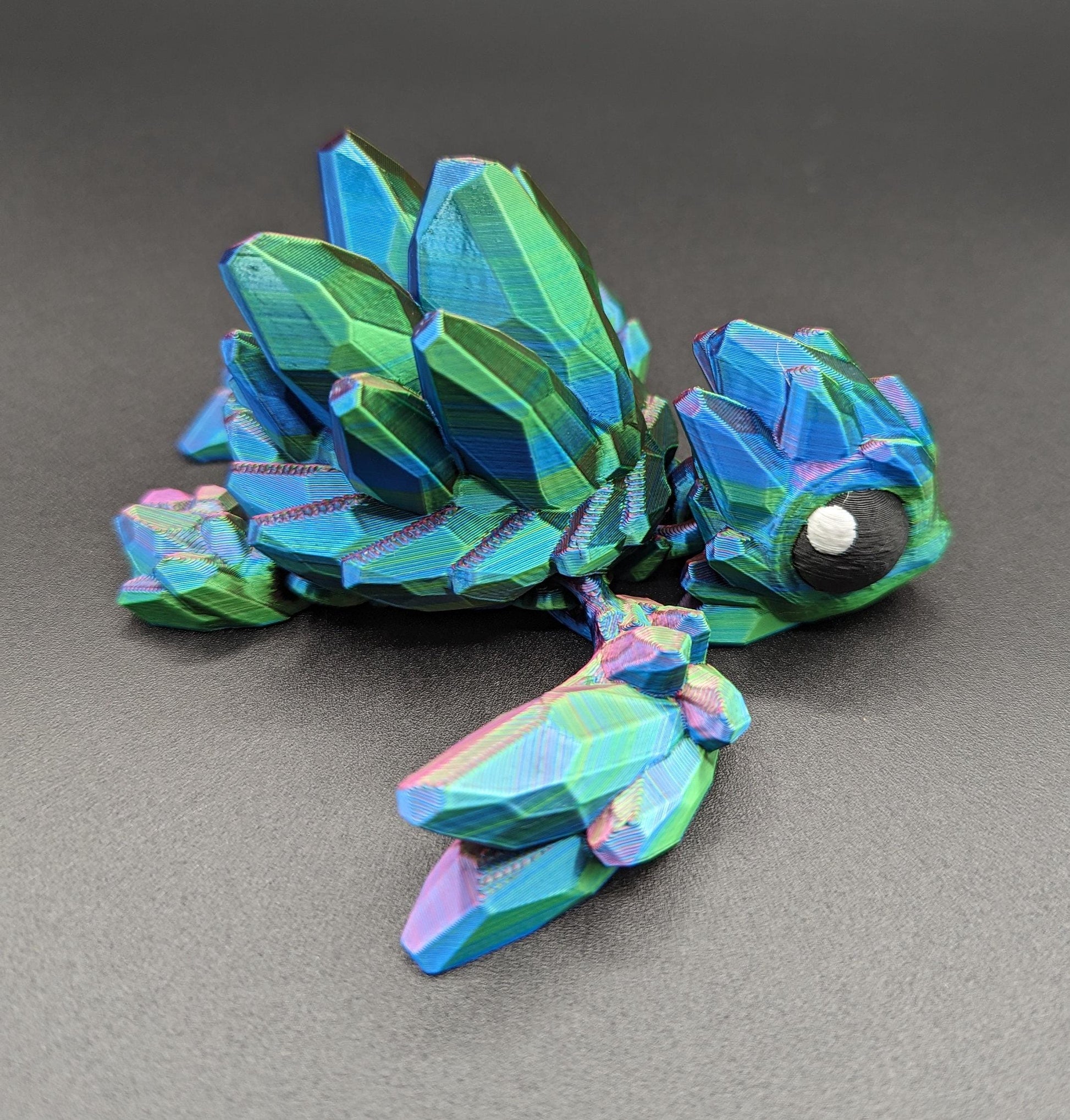 Welcome to our enchanting world of 3D Printed Gemstone Turtles! Elevate your home decor with this exquisite handcrafted sculpture that seamlessly blends artistry with nature's beauty. Our unique turtle design captures the essence of tranquility, making it a perfect addition to any space.