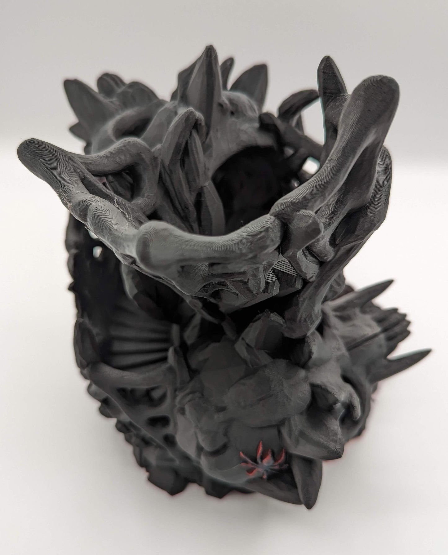 Handcrafted with eerie detail, this 3D printed dice tower combines functionality with a touch of the macabre, making it the perfect addition to any tabletop game. Whether you're a seasoned gamer or a newcomer, this spooky accessory is designed to enhance your gameplay with a chilling twist.