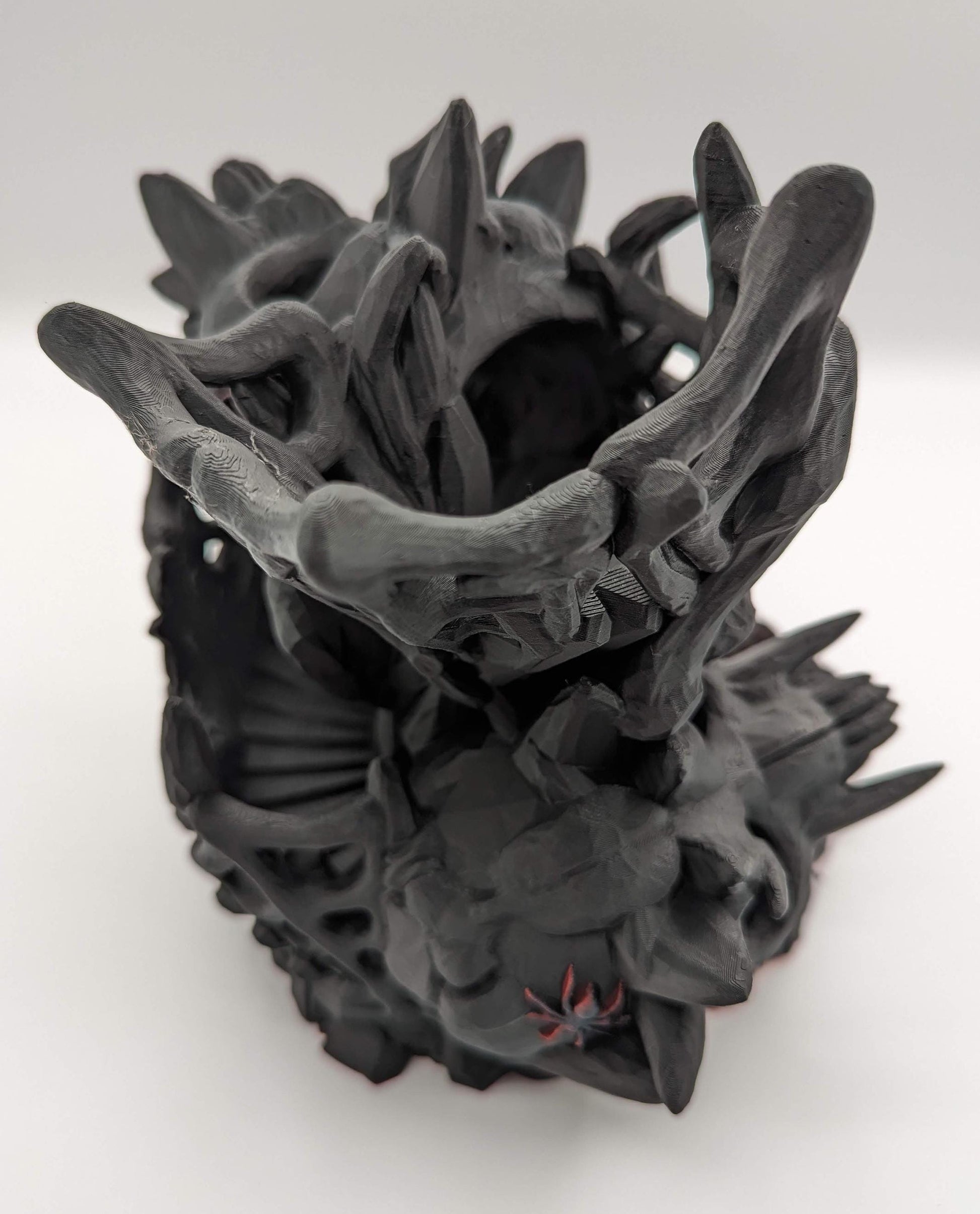 Handcrafted with eerie detail, this 3D printed dice tower combines functionality with a touch of the macabre, making it the perfect addition to any tabletop game. Whether you're a seasoned gamer or a newcomer, this spooky accessory is designed to enhance your gameplay with a chilling twist.