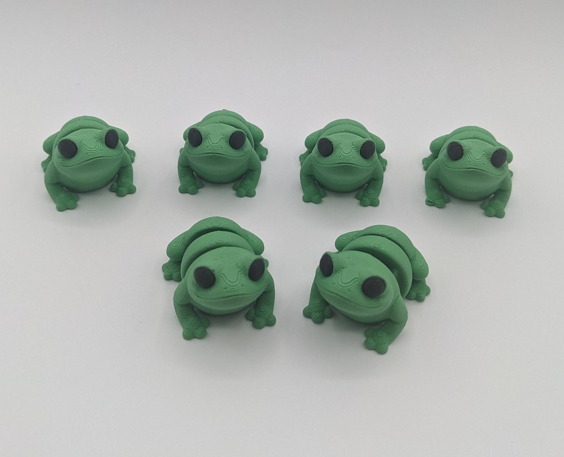 Meet our adorable 3D printed  Tiny Sensory Articulated Fidget Frog– your pocket-sized companion for stress relief and endless fun! Crafted with precision, this tiny articulated frog is more than just a toy; it's a delightful escape from the daily hustle. Feel the smooth texture and enjoy the satisfying tactile experience whenever you need a moment of calm.