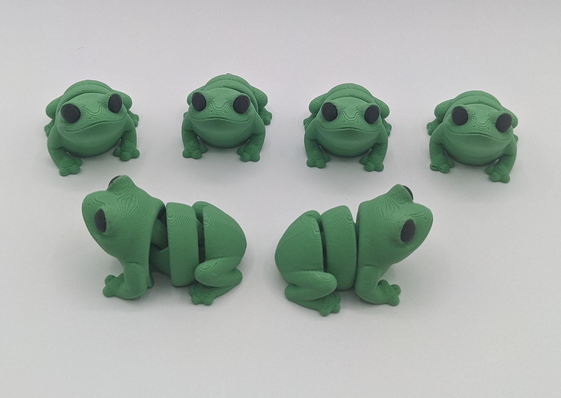 Meet our adorable 3D printed  Tiny Sensory Articulated Fidget Frog– your pocket-sized companion for stress relief and endless fun! Crafted with precision, this tiny articulated frog is more than just a toy; it's a delightful escape from the daily hustle. Feel the smooth texture and enjoy the satisfying tactile experience whenever you need a moment of calm.