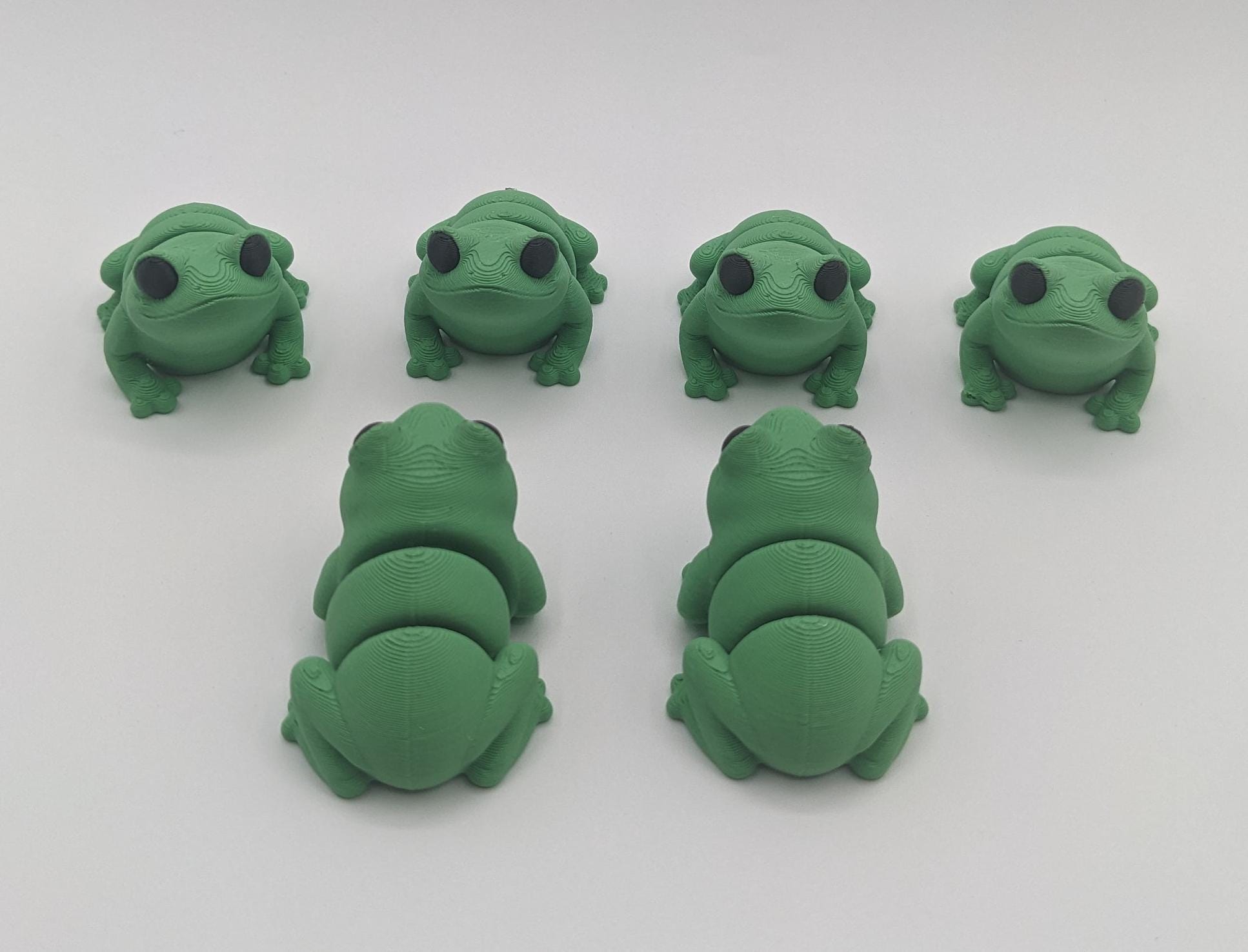 Meet our adorable 3D printed  Tiny Sensory Articulated Fidget Frog– your pocket-sized companion for stress relief and endless fun! Crafted with precision, this tiny articulated frog is more than just a toy; it's a delightful escape from the daily hustle. Feel the smooth texture and enjoy the satisfying tactile experience whenever you need a moment of calm.