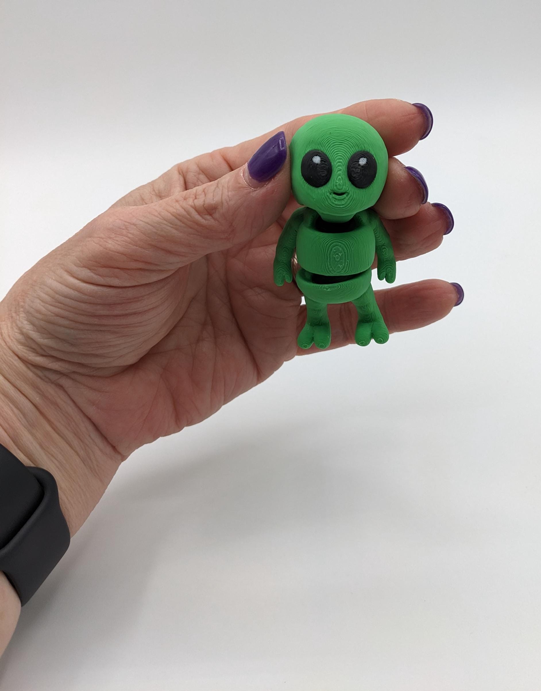 Say hello to the Tiny Alien Fidget Toy, a fun and quirky companion thatâs out of this world! This 3D-printed alien is designed for fidgeting, stress relief, and endless entertainment. Its compact size makes it perfect to carry in your pocket, and its unique design is sure to spark smiles wherever you go. Whether youâre looking for a fun desk toy, a creative gift, or a unique collectible, this tiny alien is a must-have!