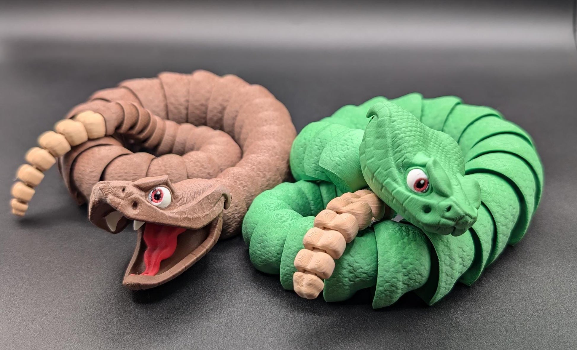 Unleash the charm of the wild with the Articulated Rattlesnake Fidget Toy, a unique 3D-printed creation that’s fun, flexible, and incredibly satisfying to play with! Designed with intricate details, this articulated rattlesnake moves and bends smoothly, providing endless entertainment and stress relief for kids, teens, and adults. Whether you're a fidget toy enthusiast, a snake lover, or just looking for a creative gift, this rattlesnake is guaranteed to be a hit.