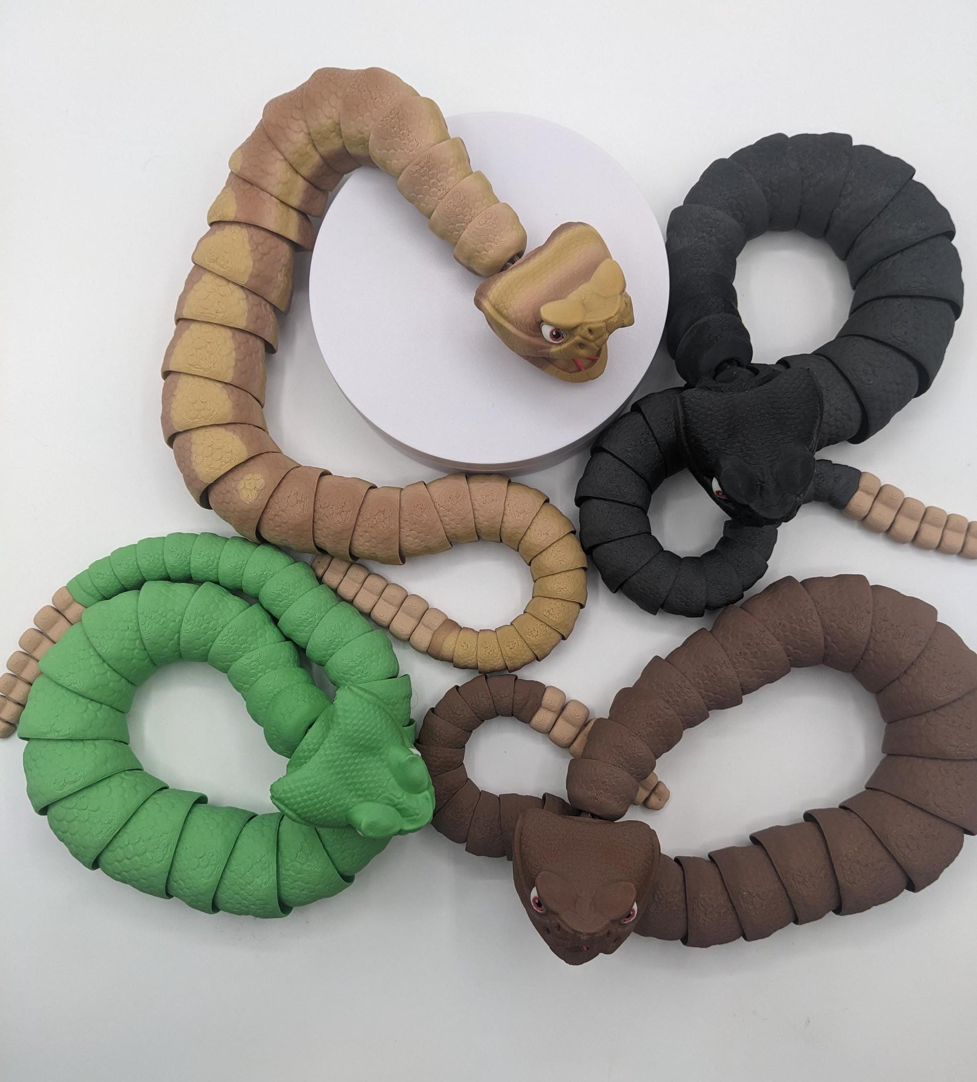 Unleash the charm of the wild with the Articulated Rattlesnake Fidget Toy, a unique 3D-printed creation that’s fun, flexible, and incredibly satisfying to play with! Designed with intricate details, this articulated rattlesnake moves and bends smoothly, providing endless entertainment and stress relief for kids, teens, and adults. Whether you're a fidget toy enthusiast, a snake lover, or just looking for a creative gift, this rattlesnake is guaranteed to be a hit.