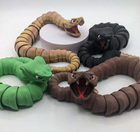 Unleash the charm of the wild with the Articulated Rattlesnake Fidget Toy, a unique 3D-printed creation that’s fun, flexible, and incredibly satisfying to play with! Designed with intricate details, this articulated rattlesnake moves and bends smoothly, providing endless entertainment and stress relief for kids, teens, and adults. Whether you're a fidget toy enthusiast, a snake lover, or just looking for a creative gift, this rattlesnake is guaranteed to be a hit.
