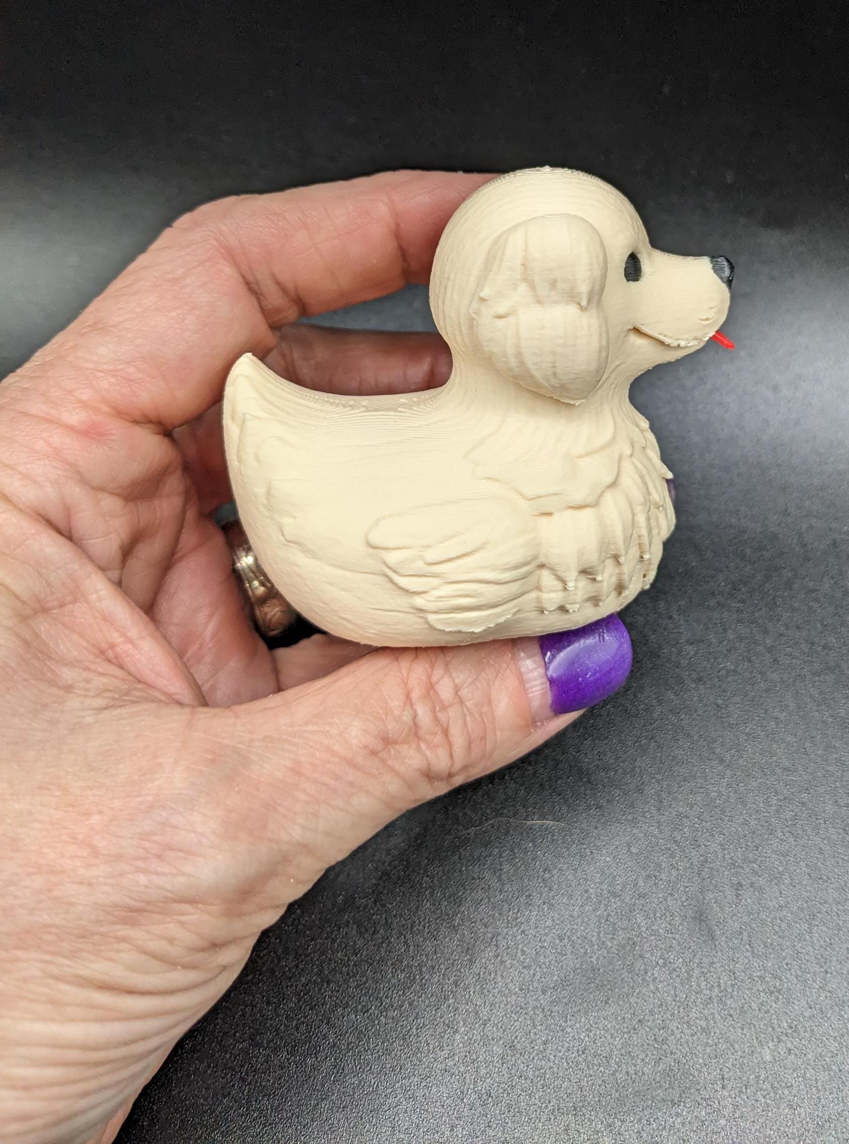 Combine the charm of a Labrador Retriever with the whimsy of a rubber duck, and you get this adorable Labrador Retriever Dog Duck! Perfect for dog lovers, duck collectors, Jeep duck collectors, or anyone who appreciates fun and unique decor, this 3D-printed hybrid is sure to bring smiles. Whether youâre looking for a playful gift, a cute collectible, or a quirky addition to your shelf, this Labrador Duck is a must-have!
