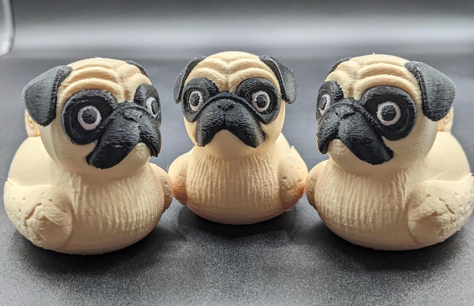 Meet The Fabulous Pug Dog Duck, a delightful 3D-printed creation that combines the charm of a pug with the whimsy of a rubber duck! This quirky and adorable design is perfect for pug lovers, Jeep duck collectors, duck enthusiasts, or anyone who enjoys playful and unique decor. Whether it’s displayed on a shelf, on the dash of your car, used as a conversation starter, or gifted to a dog or Jeep lover, this pug duck is guaranteed to bring smiles and laughter.