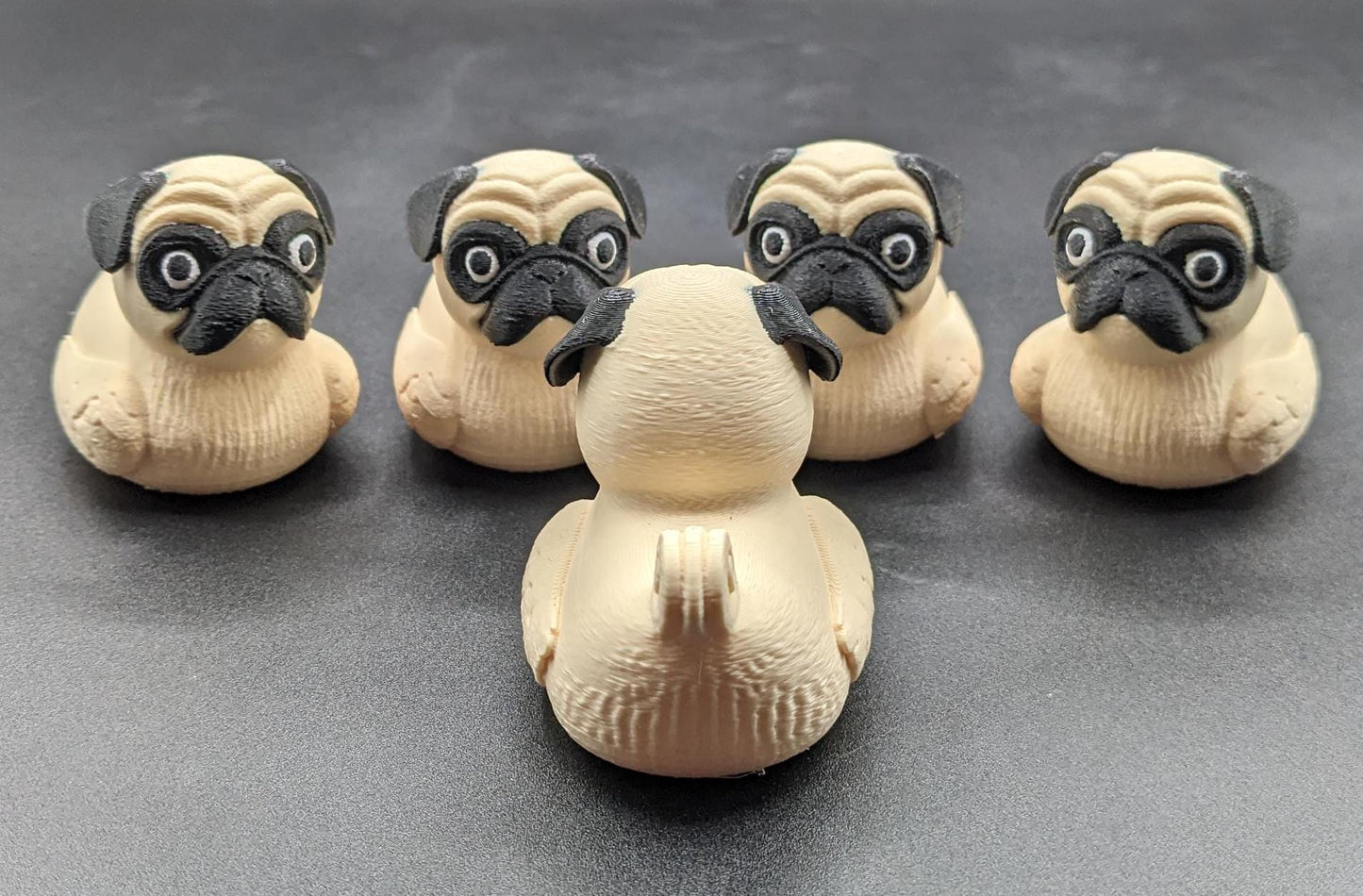 Meet The Fabulous Pug Dog Duck, a delightful 3D-printed creation that combines the charm of a pug with the whimsy of a rubber duck! This quirky and adorable design is perfect for pug lovers, Jeep duck collectors, duck enthusiasts, or anyone who enjoys playful and unique decor. Whether it’s displayed on a shelf, on the dash of your car, used as a conversation starter, or gifted to a dog or Jeep lover, this pug duck is guaranteed to bring smiles and laughter.