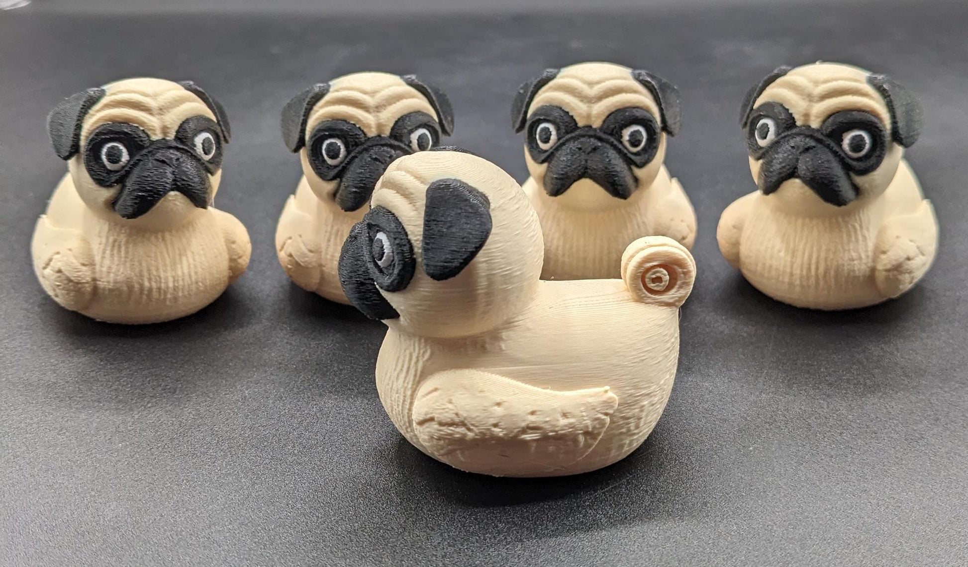 Meet The Fabulous Pug Dog Duck, a delightful 3D-printed creation that combines the charm of a pug with the whimsy of a rubber duck! This quirky and adorable design is perfect for pug lovers, Jeep duck collectors, duck enthusiasts, or anyone who enjoys playful and unique decor. Whether it’s displayed on a shelf, on the dash of your car, used as a conversation starter, or gifted to a dog or Jeep lover, this pug duck is guaranteed to bring smiles and laughter.