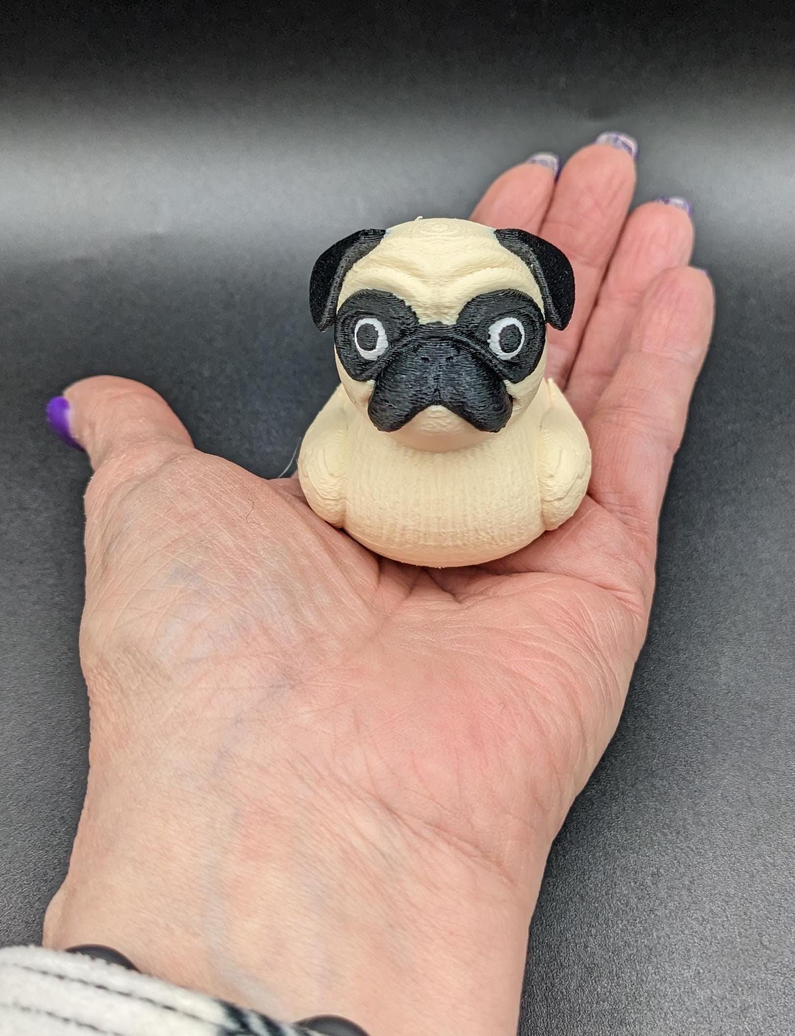 Meet The Fabulous Pug Dog Duck, a delightful 3D-printed creation that combines the charm of a pug with the whimsy of a rubber duck! This quirky and adorable design is perfect for pug lovers, Jeep duck collectors, duck enthusiasts, or anyone who enjoys playful and unique decor. Whether it’s displayed on a shelf, on the dash of your car, used as a conversation starter, or gifted to a dog or Jeep lover, this pug duck is guaranteed to bring smiles and laughter.