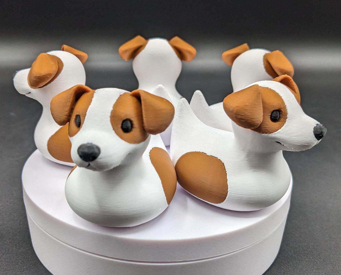 All our ducks are printed in PETG filament, a more expensive filament without the upcharge, as PETG is UV stable, heat and moisture tolerant. PLA color will fade if left on the dash of a car or in direct sunlight. Say hello to the Friendly Jack Russell Terrier Dog Duck Toy, the perfect blend of playful charm and quirky creativity! Whether you’re a dog lover, a Jeep duck collector, or simply someone who enjoys unique and fun decor, this adorable hybrid toy is sure to bring a smile to your face.