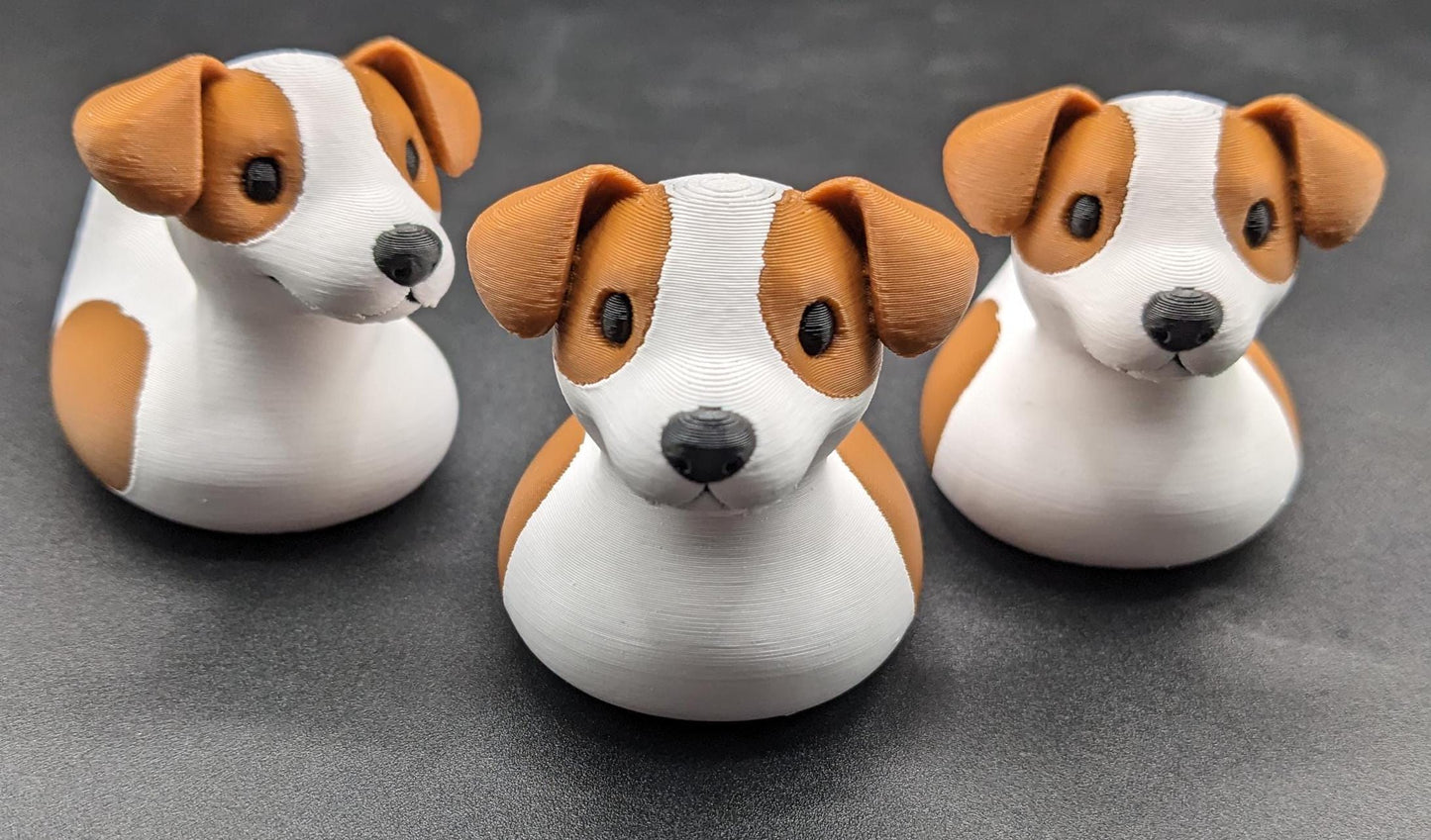 All our ducks are printed in PETG filament, a more expensive filament without the upcharge, as PETG is UV stable, heat and moisture tolerant. PLA color will fade if left on the dash of a car or in direct sunlight. Say hello to the Friendly Jack Russell Terrier Dog Duck Toy, the perfect blend of playful charm and quirky creativity! Whether you’re a dog lover, a Jeep duck collector, or simply someone who enjoys unique and fun decor, this adorable hybrid toy is sure to bring a smile to your face.