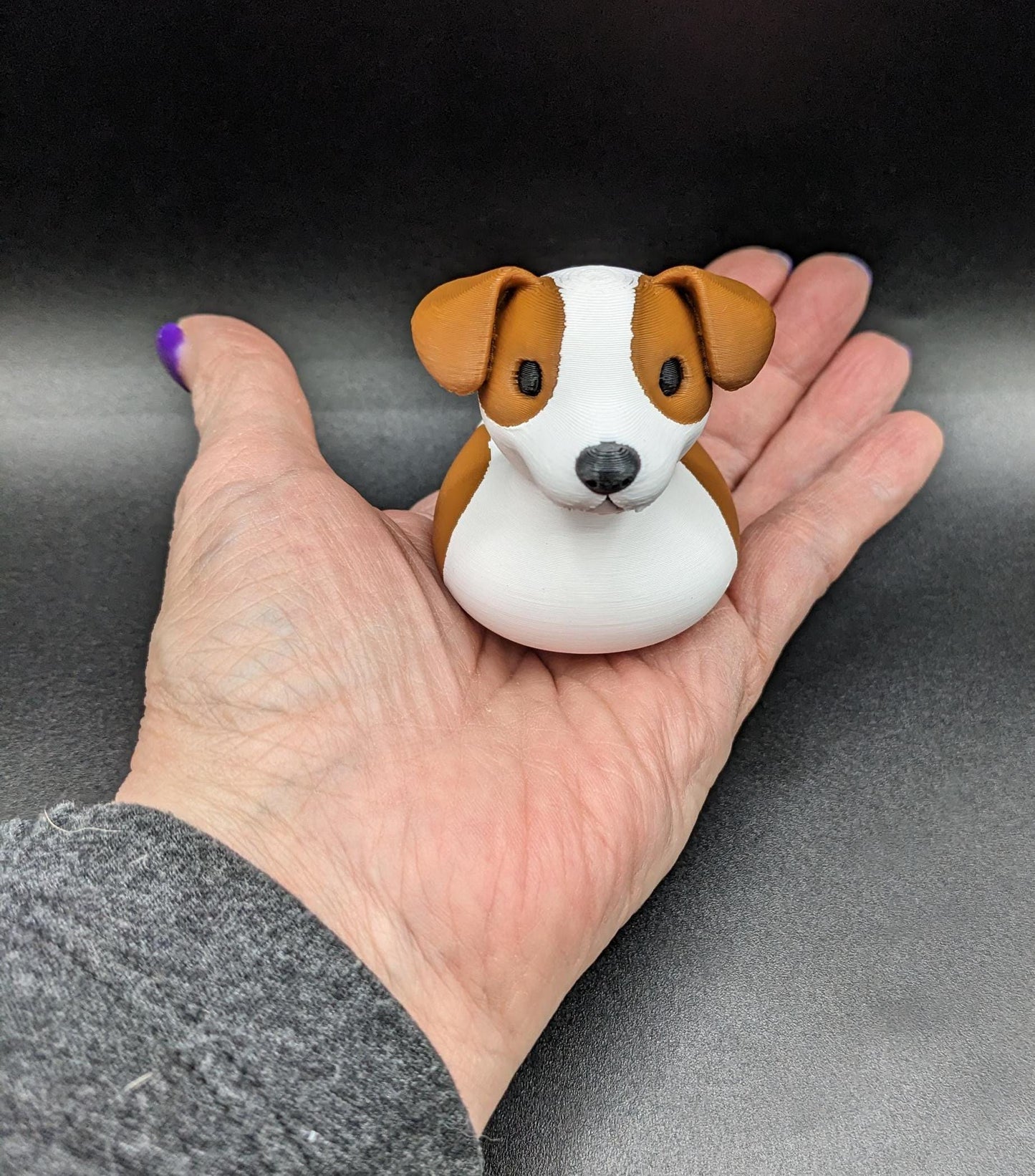 All our ducks are printed in PETG filament, a more expensive filament without the upcharge, as PETG is UV stable, heat and moisture tolerant. PLA color will fade if left on the dash of a car or in direct sunlight. Say hello to the Friendly Jack Russell Terrier Dog Duck Toy, the perfect blend of playful charm and quirky creativity! Whether you’re a dog lover, a Jeep duck collector, or simply someone who enjoys unique and fun decor, this adorable hybrid toy is sure to bring a smile to your face.