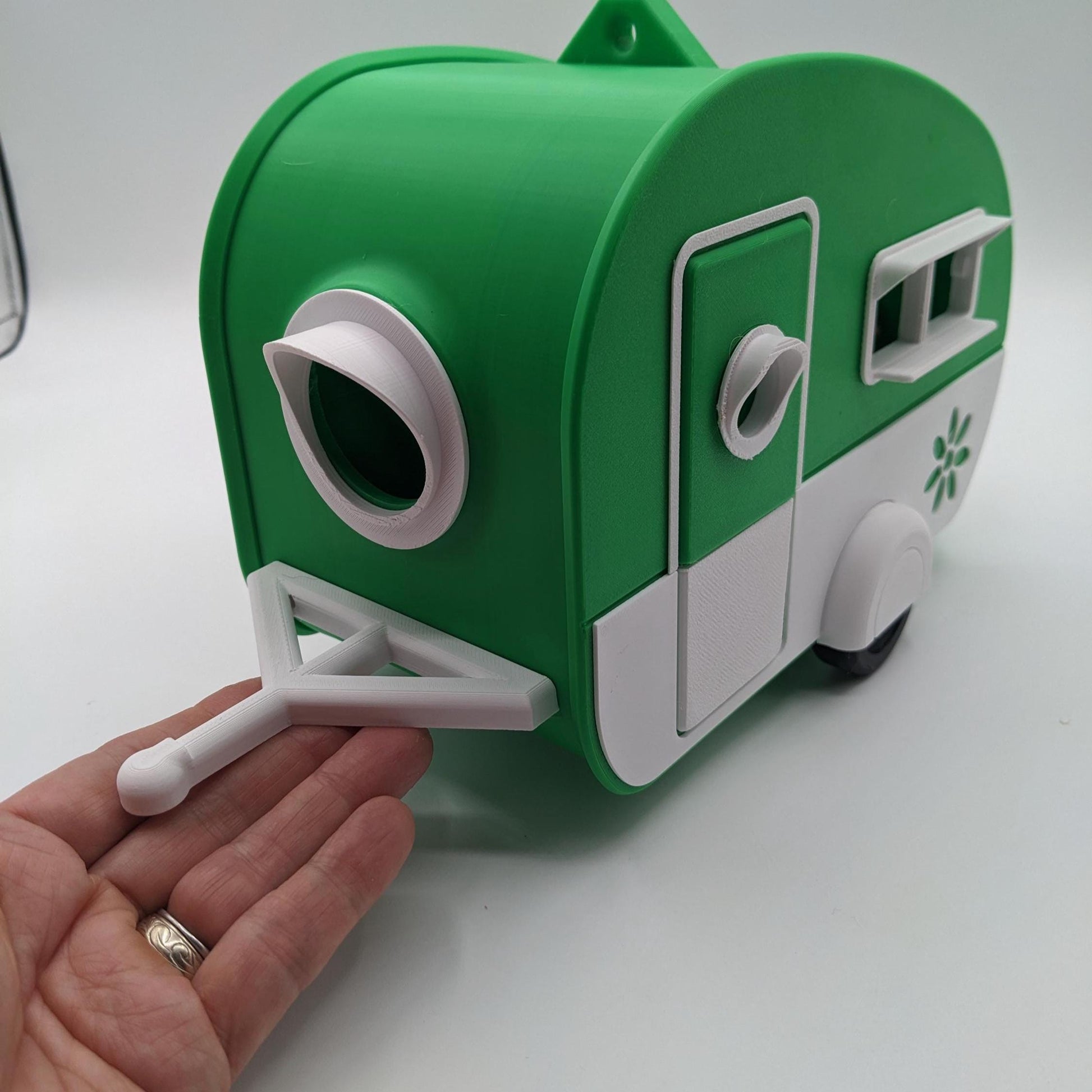 Turn your backyard into a bird lover’s paradise with the Retro RV Caravan Birdhouse! This charming and unique 3D-printed birdhouse is designed to look like a retro camper, bringing a touch of nostalgia and whimsy to your outdoor space. Perfect for bird enthusiasts, RV lovers, or anyone who adores fun and creative decor, this birdhouse is both functional and stylish.