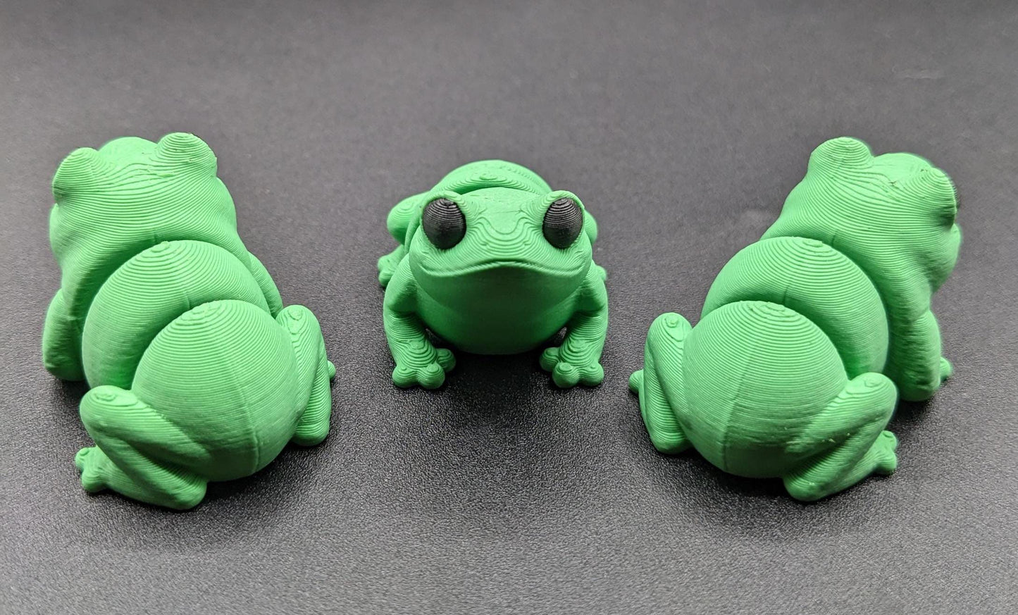 Meet our adorable 3D printed  Tiny Sensory Articulated Fidget Frog– your pocket-sized companion for stress relief and endless fun! Crafted with precision, this tiny articulated frog is more than just a toy; it's a delightful escape from the daily hustle. Feel the smooth texture and enjoy the satisfying tactile experience whenever you need a moment of calm.