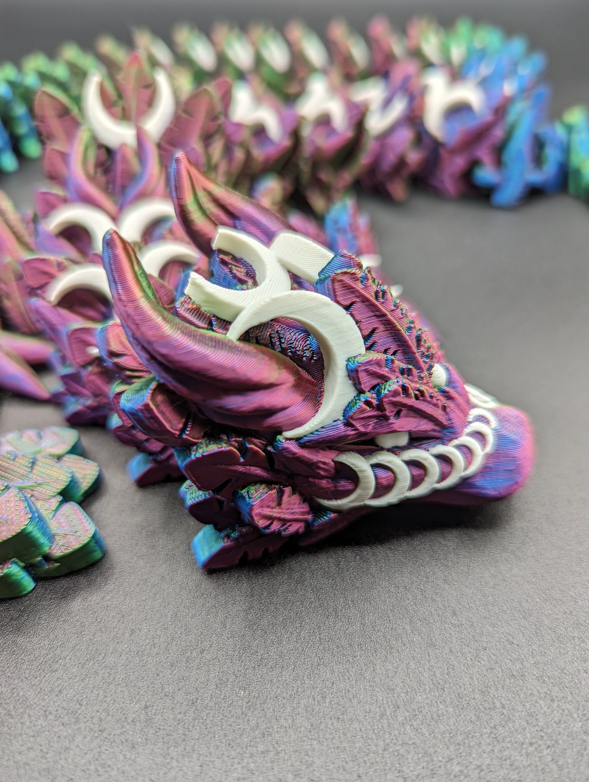 Introducing our Mystical Lunar Dragon, a captivating piece perfect for fantasy lovers and collectors alike. This ethereal dragon is designed to add a touch of magic and wonder to any space.