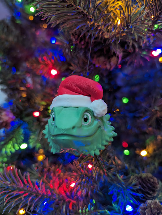 This charming ornament brings a touch of reptilian charm to your Christmas tree, making it a delightful and unique way to celebrate the season.
