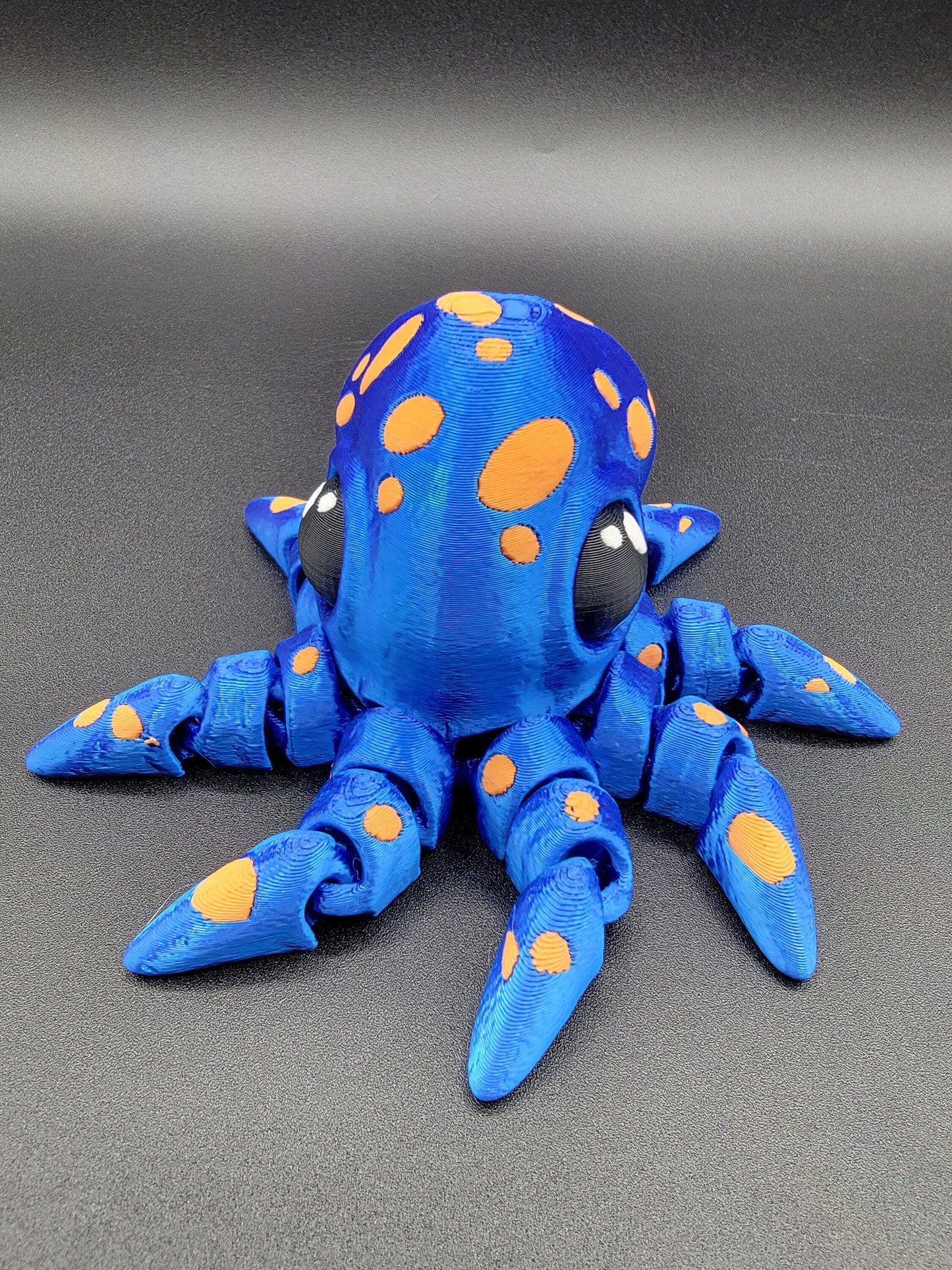 Dive into a world of cuteness and fun with the Adorable Articulated Tiny Octopus! This charming 3D-printed octopus features fully articulated tentacles, making it perfect as a relaxing fidget toy, a playful desk companion