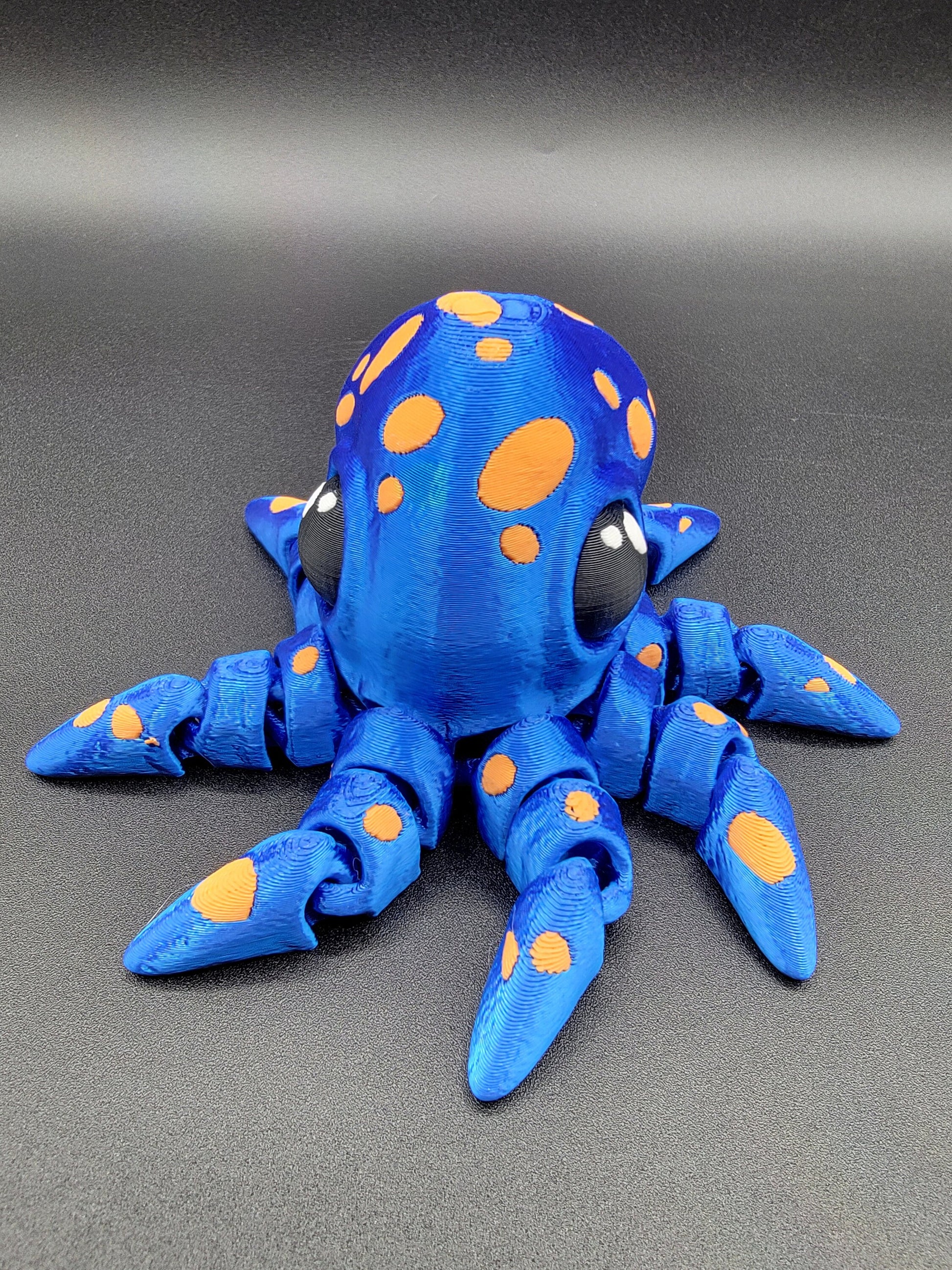 Dive into a world of cuteness and fun with the Adorable Articulated Tiny Octopus! This charming 3D-printed octopus features fully articulated tentacles, making it perfect as a relaxing fidget toy, a playful desk companion