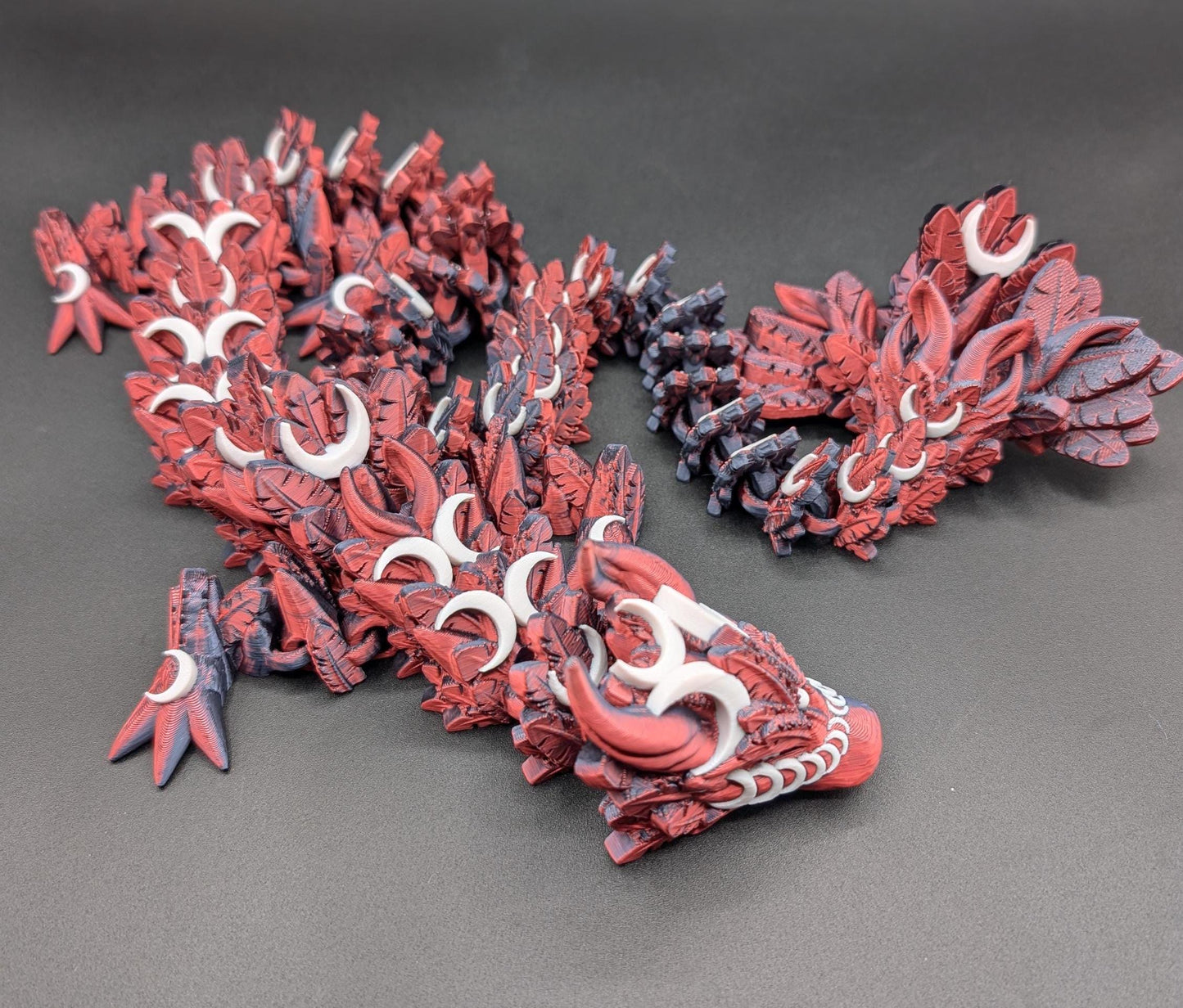 Introducing our Mystical Lunar Dragon, a captivating piece perfect for fantasy lovers and collectors alike. This ethereal dragon is designed to add a touch of magic and wonder to any space.