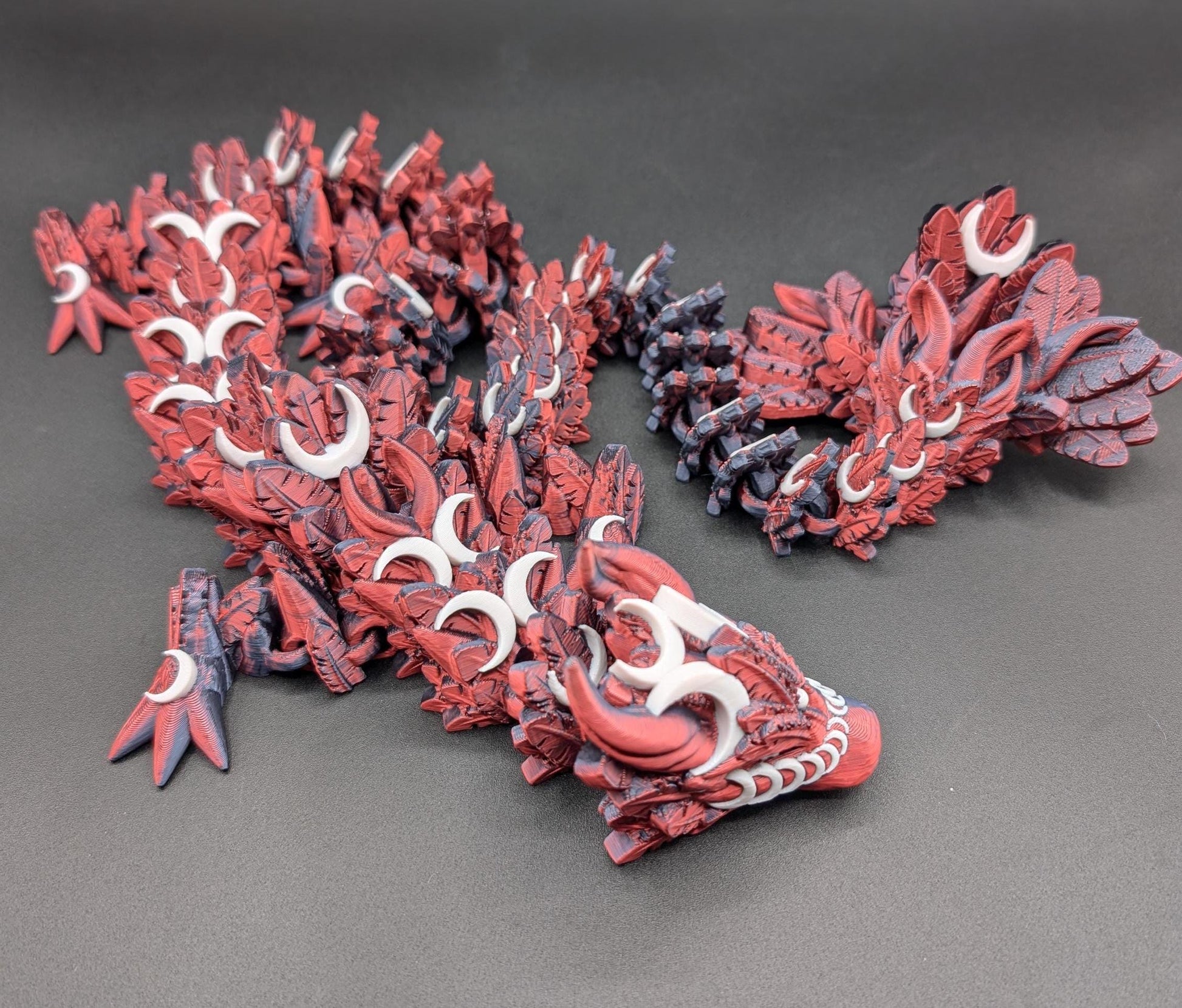 Introducing our Mystical Lunar Dragon, a captivating piece perfect for fantasy lovers and collectors alike. This ethereal dragon is designed to add a touch of magic and wonder to any space.