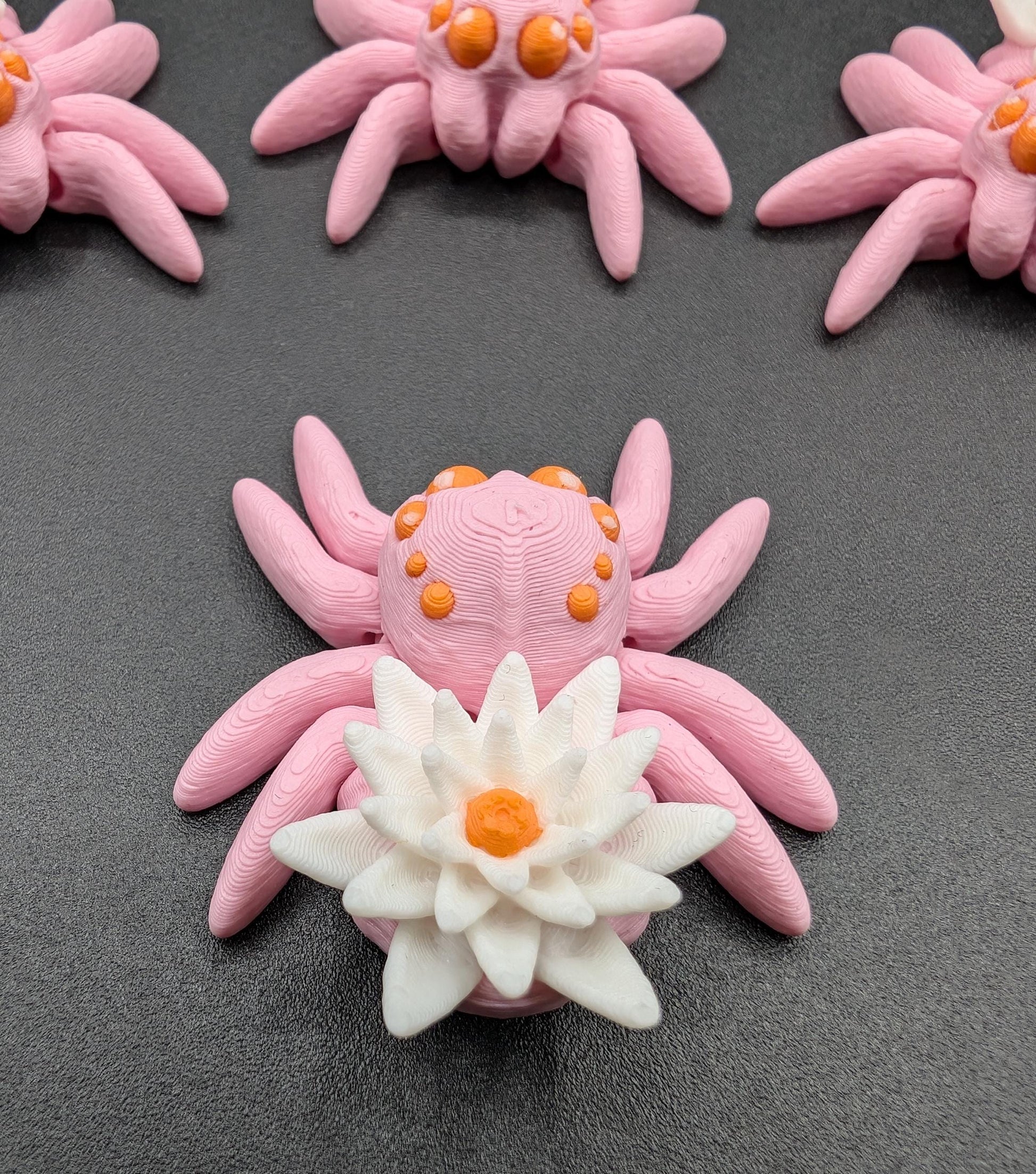 Introducing our Beautiful Articulating Water Lily Spider, a stunning blend of nature and art. Perfect for collectors and decor enthusiasts, this unique spider adds a touch of grace and whimsy to any space.