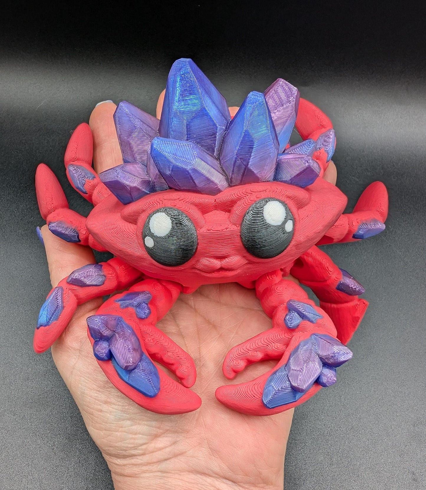 Introducing our Articulated Crystal Gemstone Crab Fidget Toy, a captivating blend of beauty and stress relief. Perfect for fidget enthusiasts and ocean lovers, this charming crab offers a unique way to unwind.