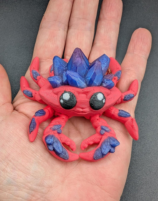 Introducing our Articulated Crystal Gemstone Crab Fidget Toy, a captivating blend of beauty and stress relief. Perfect for fidget enthusiasts and ocean lovers, this charming crab offers a unique way to unwind.
